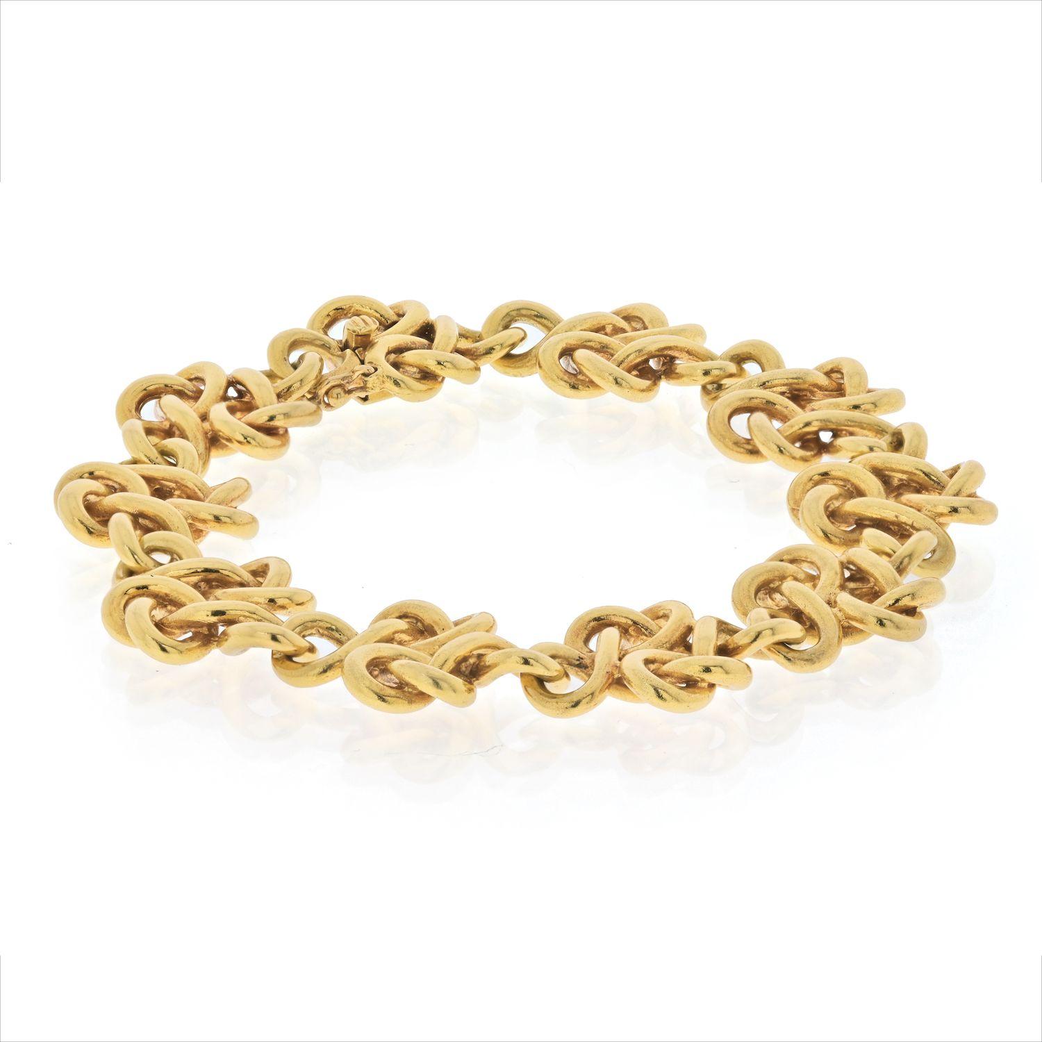 Van Cleef & Arpels 18K Yellow Gold Delicate Braided Open Link Bracelet.
This beautiful bracelet is 7 inches long and is polished to perfection. Smooth links will feel great on your skin and stack well with other vintage bracelets. 
Own this
