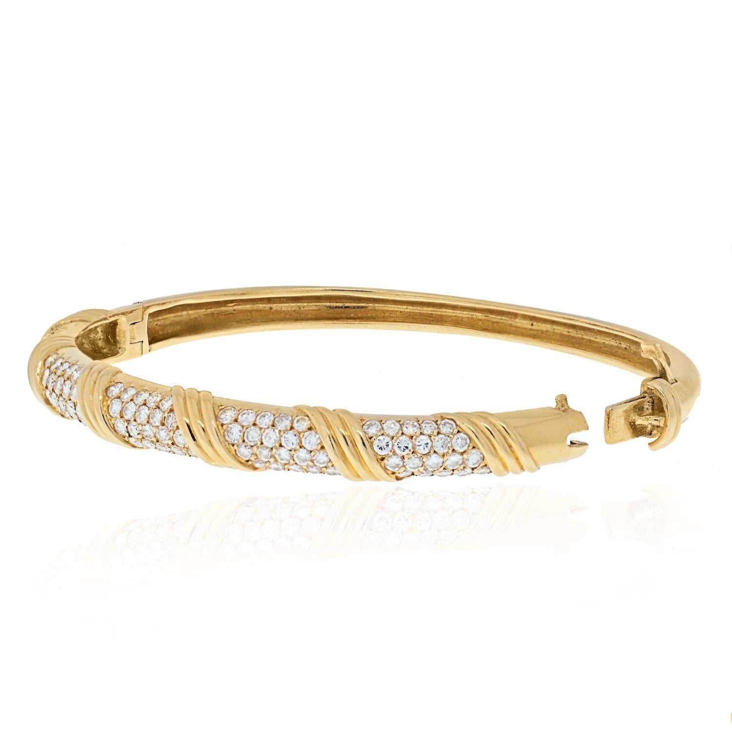 Vintage Van Cleef and Arpels French Bracelet. Intricate gold work and rows of diamonds. 
Signed Van Cleef and Arpels, French, Circa 1970.
Diamonds: Round Diamonds 4.00cts 
Width: 6.5mm
Wrist Size: 6.25 inches
