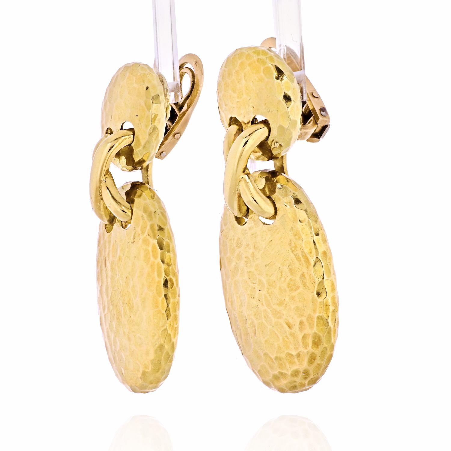 Presented here is a pair of yellow gold hammered finish Van Cleef & Arpels clip-earrings. 
Measuring about 2 inches long these earrings offer a chic way to brighten up your everyday outfit. Attractive high polish look.
