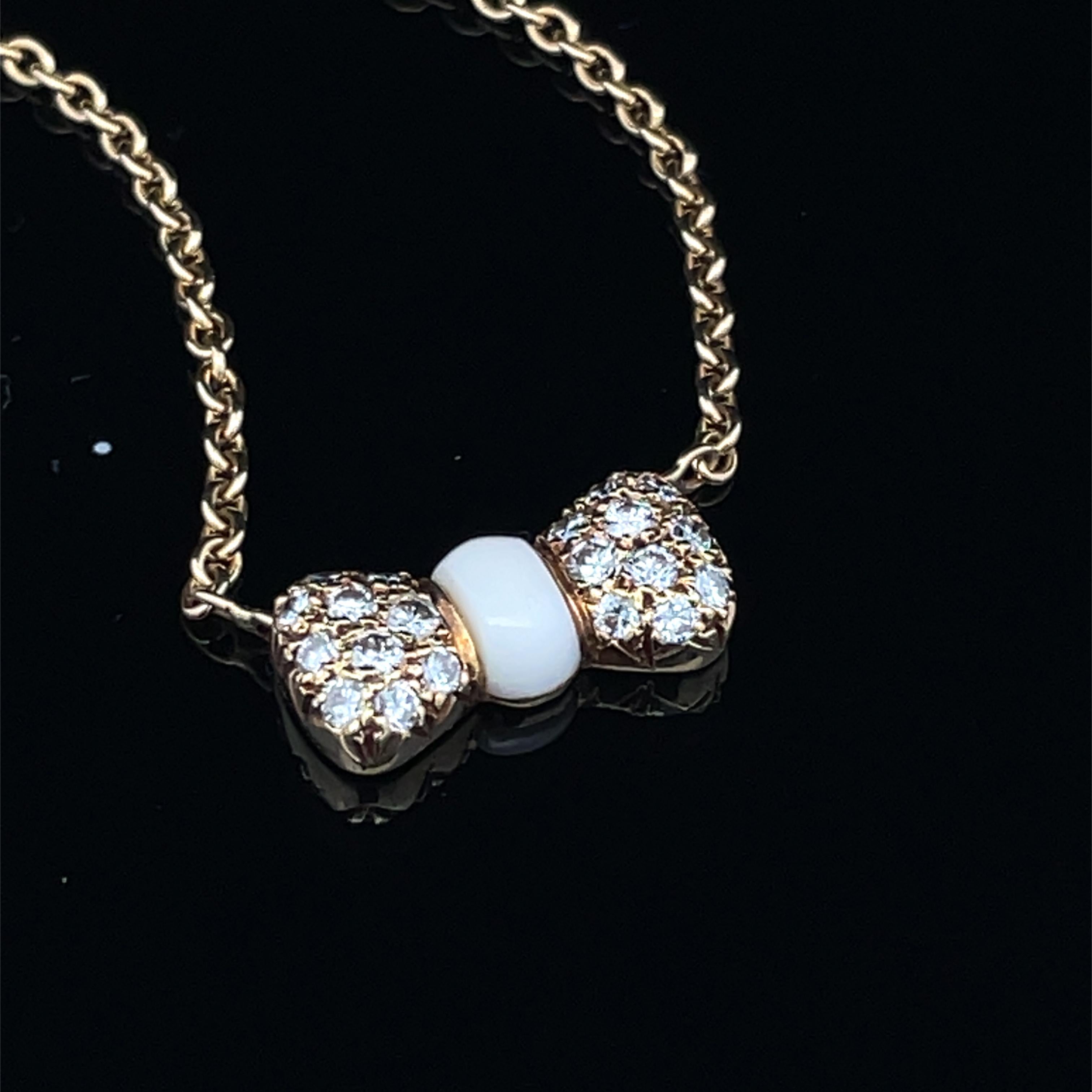 Round Cut Van Cleef & Arpels 18k Yellow Gold White Coral & Diamond Bow Pendant Necklace For Sale