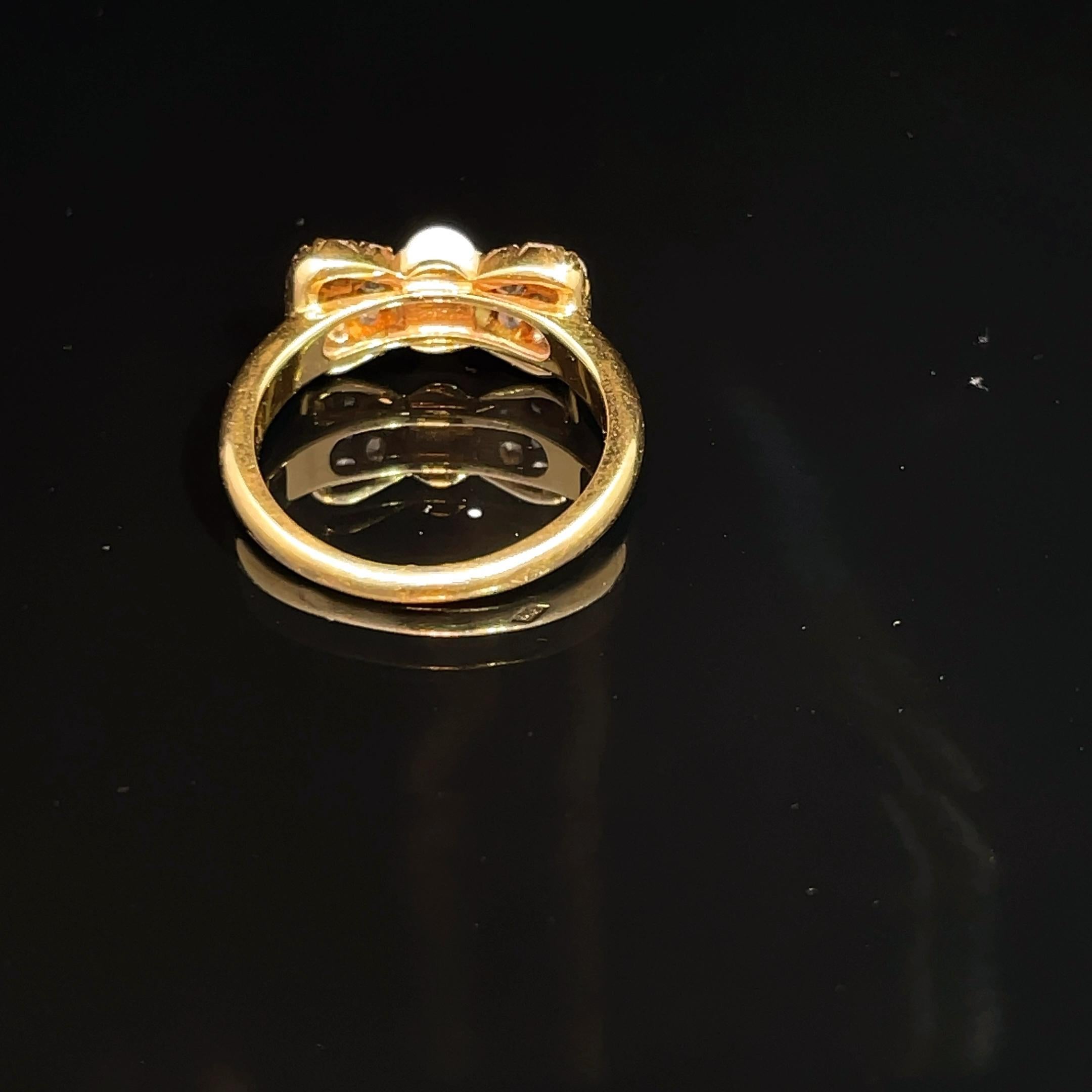 Van Cleef & Arpels 18k Yellow Gold White Coral & Diamond Bow Ring In Excellent Condition For Sale In New York, NY