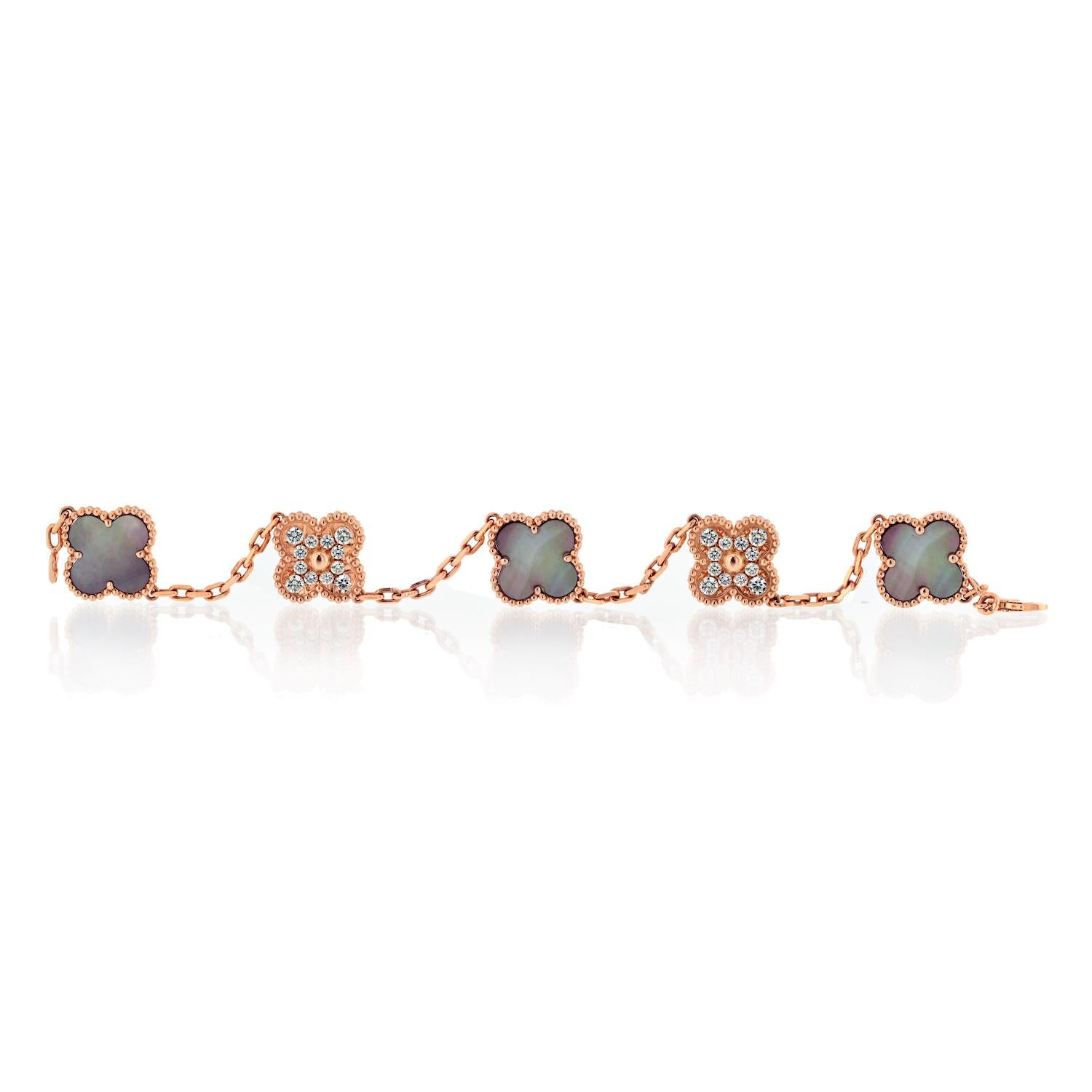 Van Cleef & Arpels 18KR Gold 5 Motif Grey Mother Of Pearl And Diamond Bracelet.

Crafted meticulously with 18K rose gold, this exquisite bracelet features five meticulously crafted motifs adorned with the finest materials.

Each motif is delicately