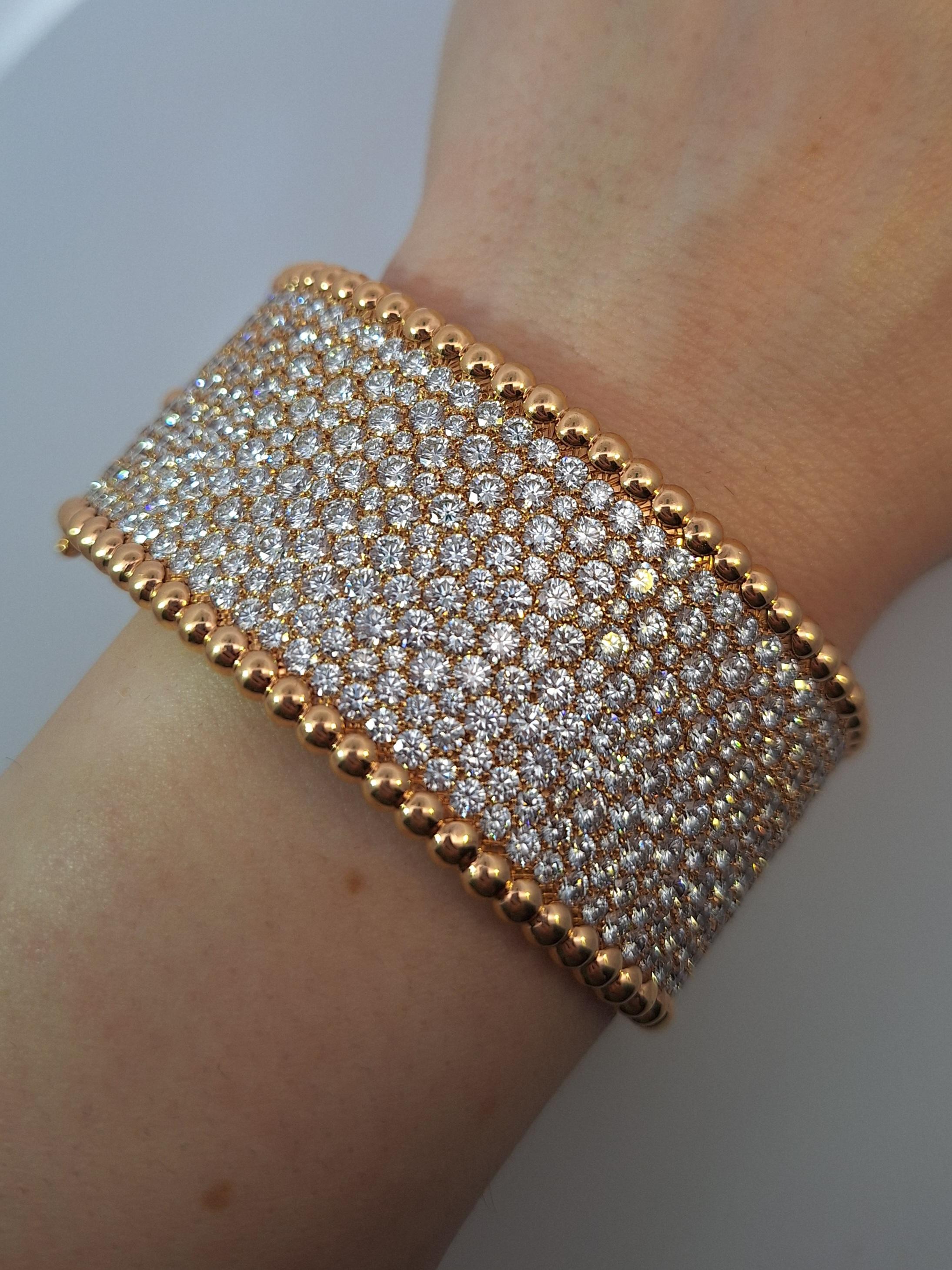 Description

Property of a Princess



Gold and diamond bangle, 'Perlée', Van Cleef & Arpels



The wide hinged bangle pavé-set with brilliant-cut diamonds, bordered by lines of gold beads, inner circumference approximately 170mm, signed Van Cleef &