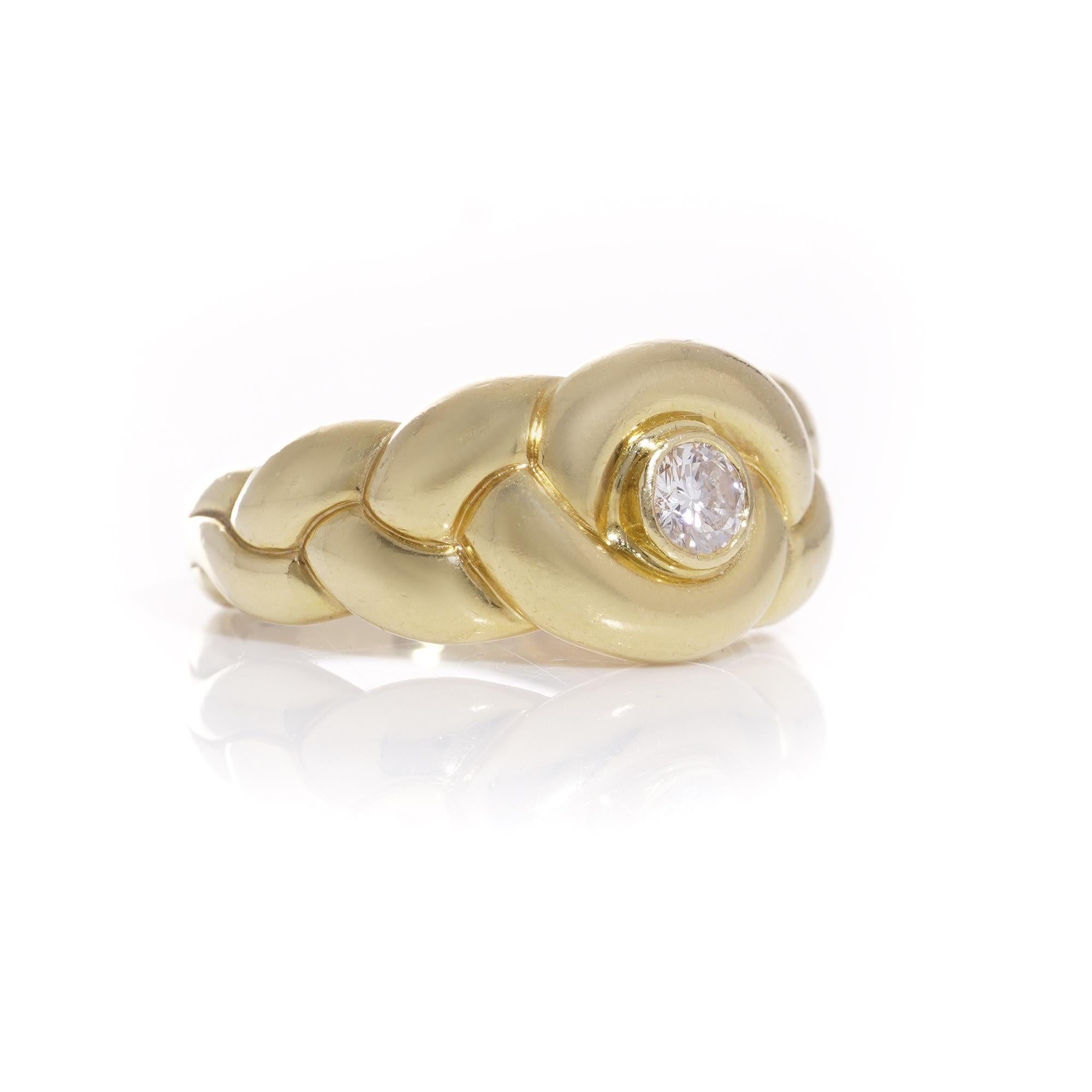 Introducing a timeless symbol of elegance and sophistication: the Van Cleef & Arpels 18kt. yellow gold braid design ring. Crafted with meticulous attention to detail, this exquisite piece features a captivating braid design, expertly woven in