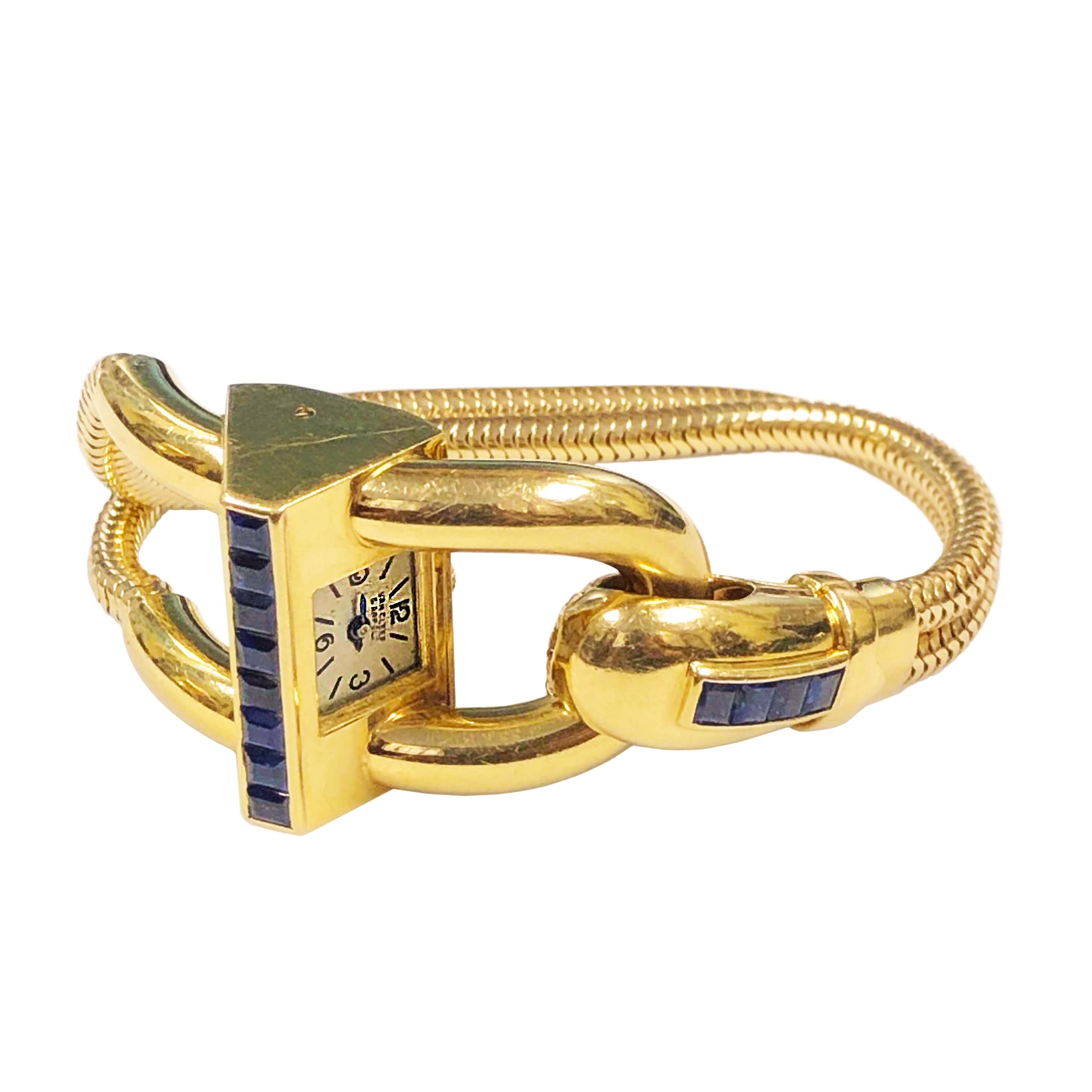 Circa 1940s Van Cleef & Arpels Cadenas 18K Yellow Gold Wrist Watch, measuring 7 inches in length and 1 inch wide, flexible snake bracelet, set with very fine color step cut Square Sapphires. 17 Jewel Mechanical, Manual wind movement, Silver Satin