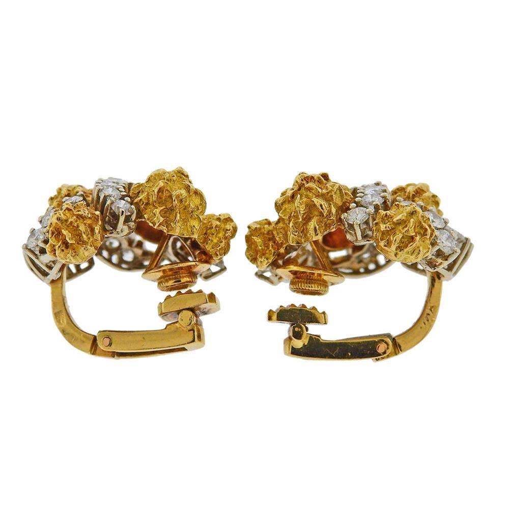 Pair of 1960s 18k gold earrings  by Van Cleef & Arpels, set with approx. 3.40ctw in diamonds. Earrings measure 25mm x 23mm. Marked VCA (one the back of one earring) Hallmark. Weight - 24 grams.E-01846