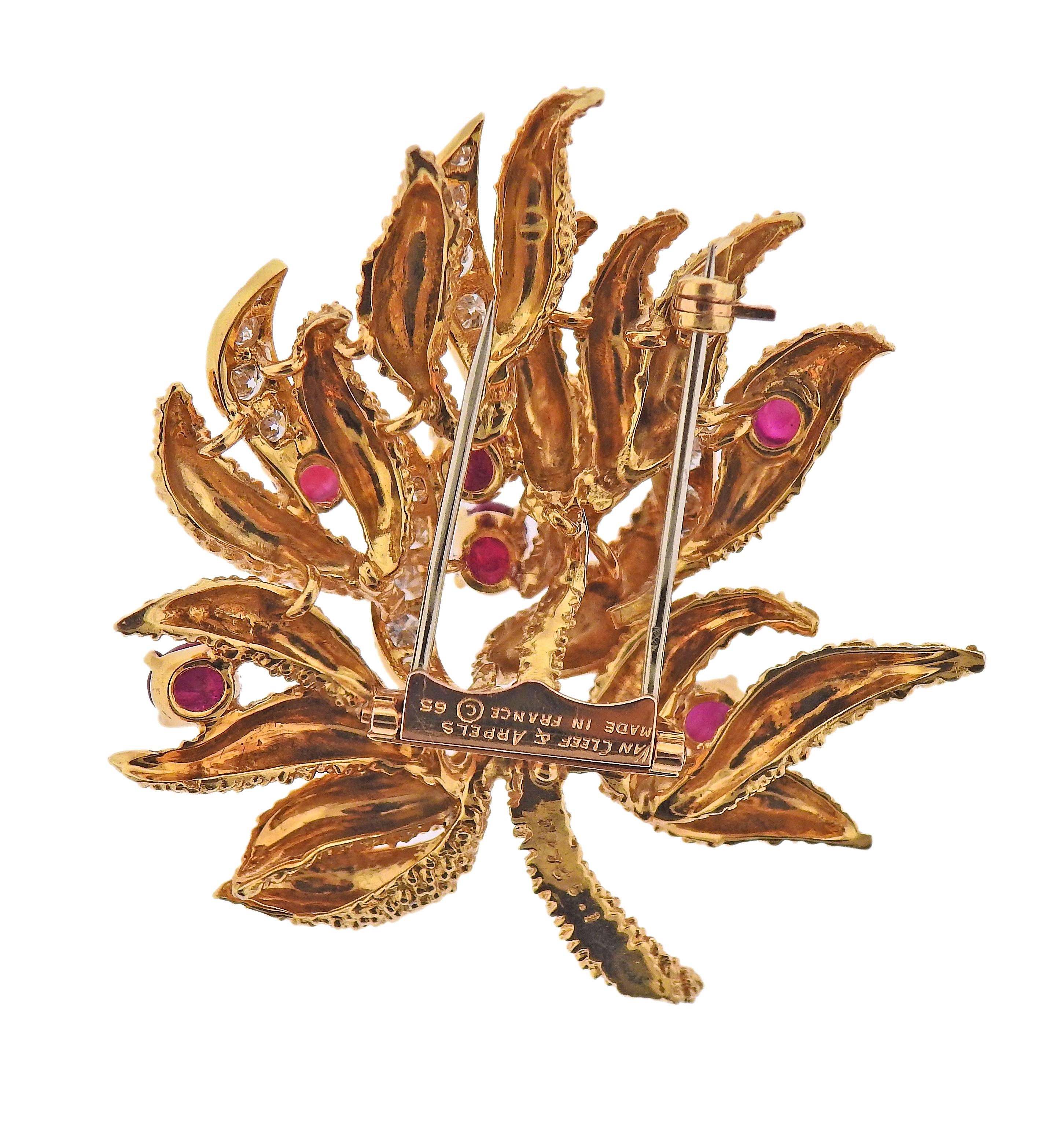 1960s vintage Van Cleef & Arpels, brooch in 18k gold, with ruby cabochons and approx. 1.00ctw in diamonds. Brooch is 1 7/8