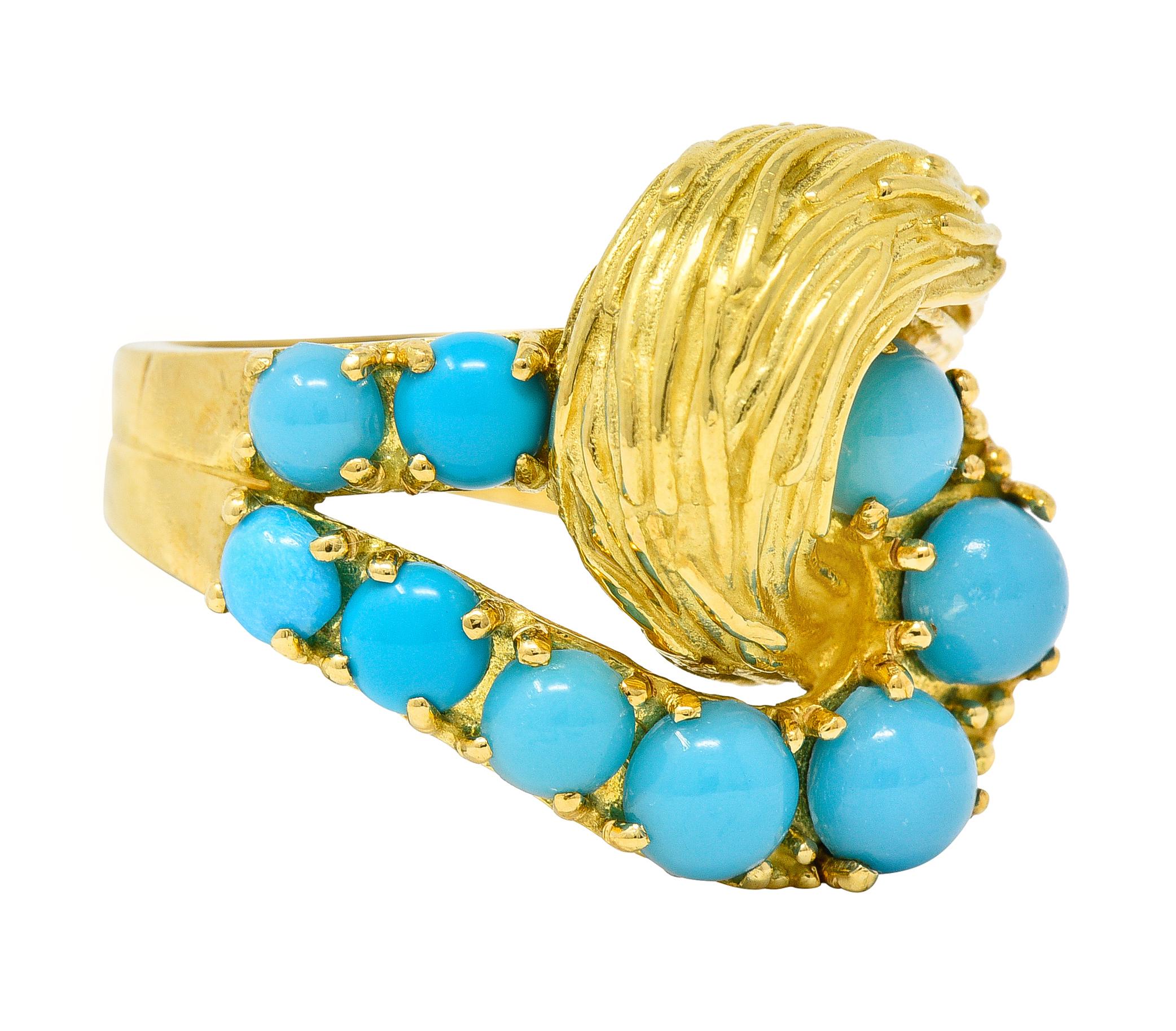 Designed with entwined looping terminals - one features graduated prong set turquoise cabochons
Ranging in size from 3.0 to 5.0 mm round - opaque light to medium robin's egg blue in color
The other terminal consists of deeply grooved textured