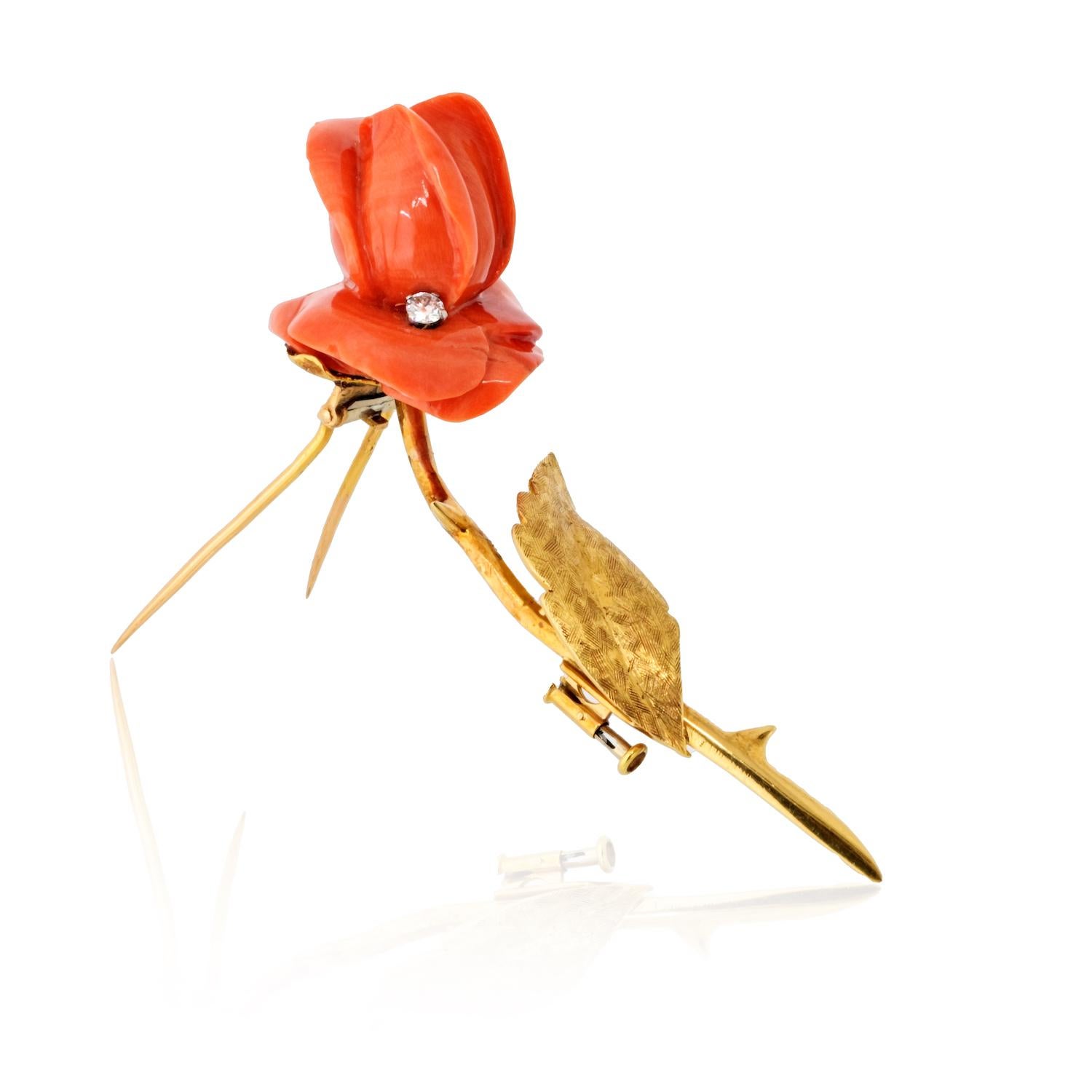This exquisite vintage brooch by Van Cleef & Arpels, crafted in 1965, is a timeless piece in the shape of a delicate rose. Hand-carved from coral, the rose measures approximately 5cm in length and is mounted in 18K yellow gold. A single round-cut