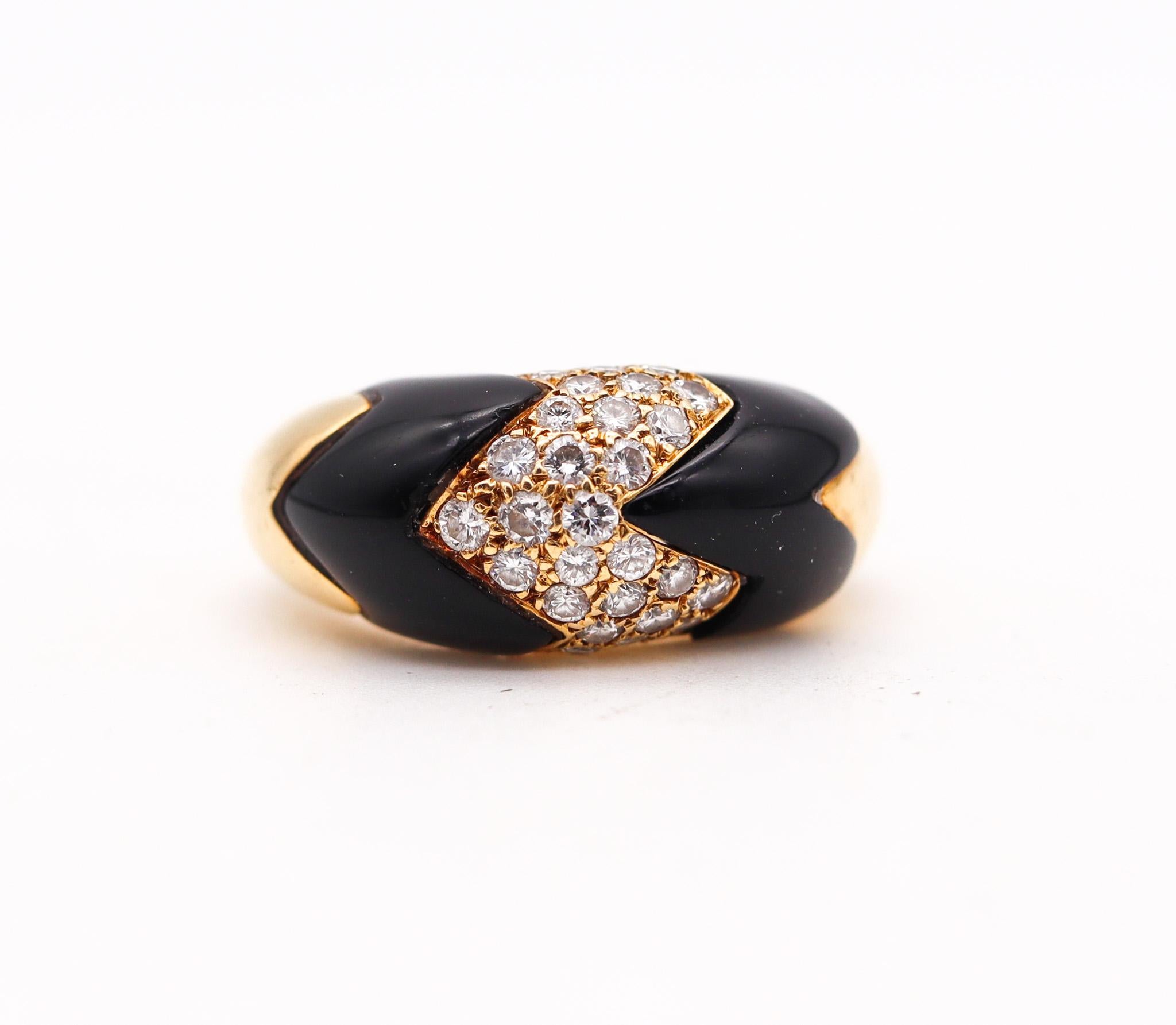 Gem set onyx ring designed by Van Cleef & Arpels.

Beautiful vintage ring, made in Paris France by the jewelry house of Van Cleef & Arpels, back in the 1970. This ring has been crafted with geometric patterns in solid yellow gold of 18 karats, with