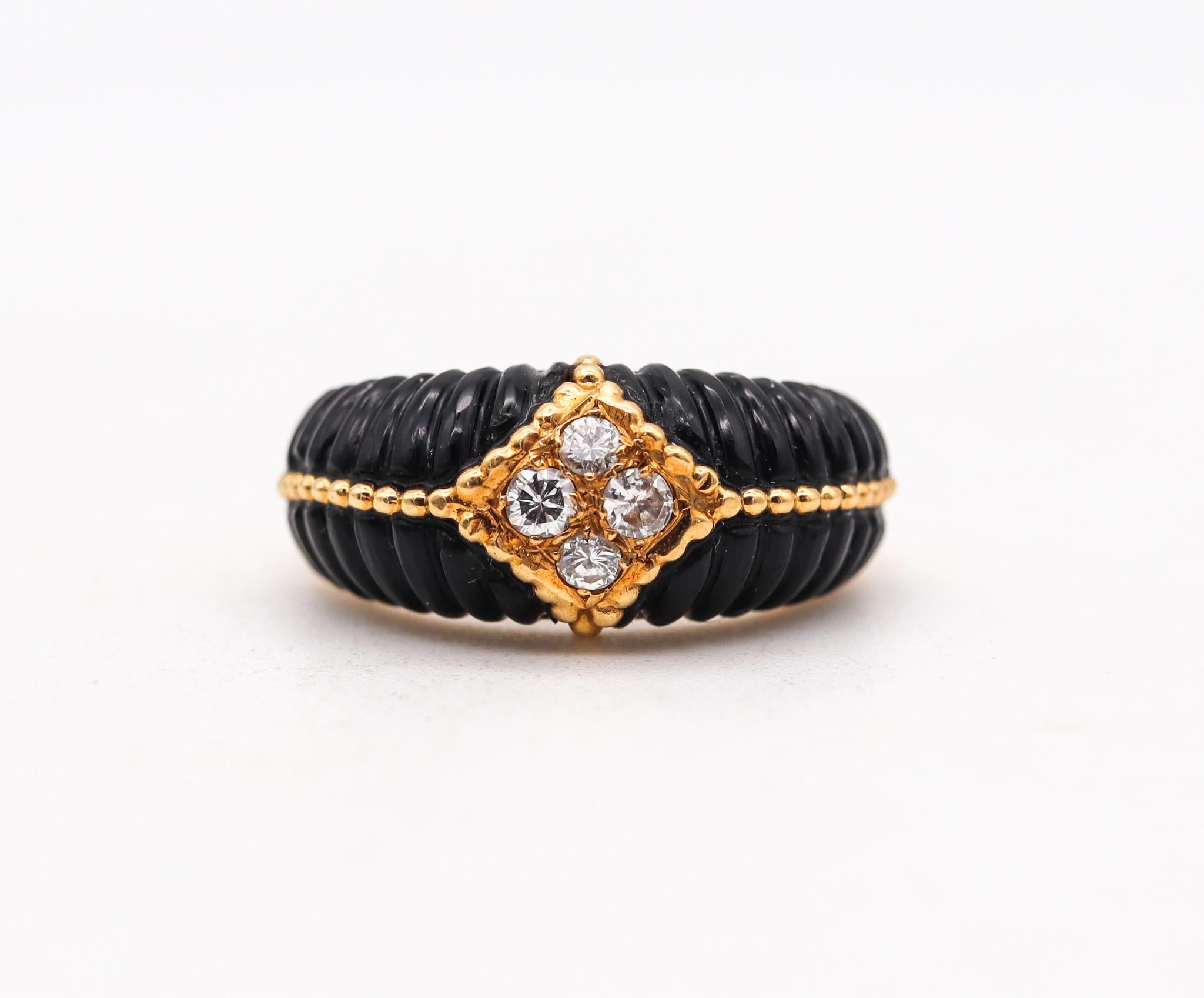 Band ring designed by Van Cleef & Arpels.

A vintage ring made in Paris France circa late 1970's. It was crafted by the house of Van Cleef & Arpels in solid yellow gold of 18 karats with high polished finish and embellished with four special fluted