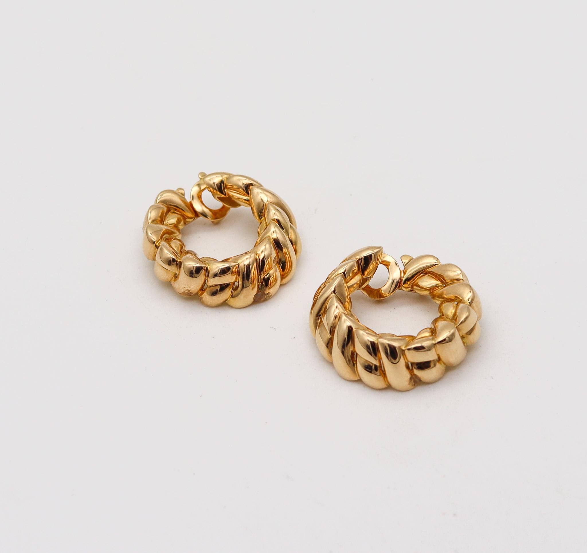 Hoops earrings designed by Van Cleef & Arpels.

Fabulous statements pair of hoops-earrings, created in Paris France by the jewelry house of Van Cleef & Arpels, back in the 1970's. This pair has been crafted as a left and right in solid yellow gold