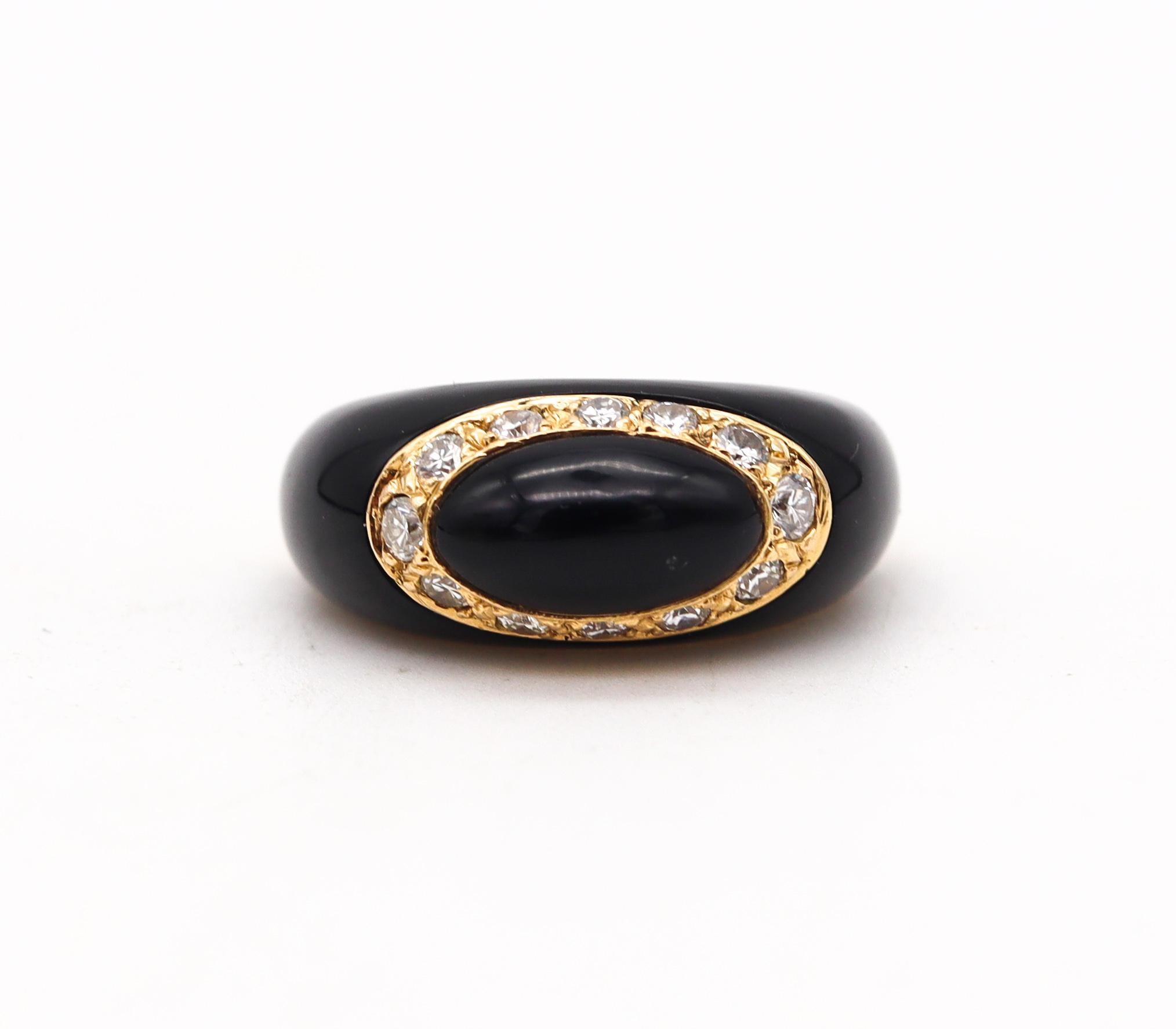 Jeweled ring designed by Van Cleef & Arpels.

A vintage bombe ring made in Paris France circa late 1970's. It was crafted by the house of Van Cleef & Arpels in solid yellow gold of 18 karats with high polished finish and embellished with two special