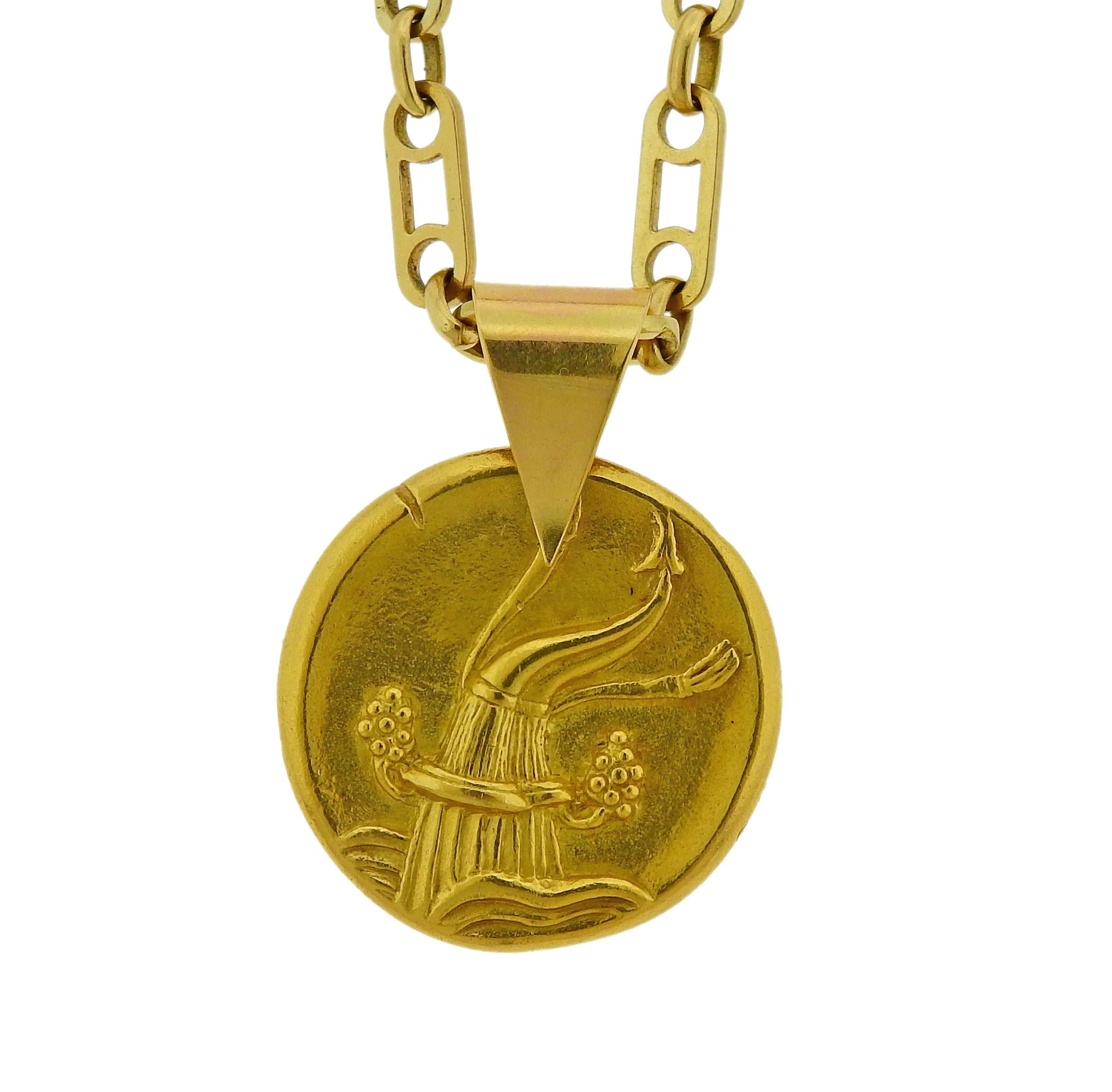 Vintage circa 1970s 18k gold pendant and necklace by Van Cleef & Arpels, depicting Aquarius zodiac sign. Pendant is 26mm in diameter x 35mm long with bale (bale opens), Necklace is 24