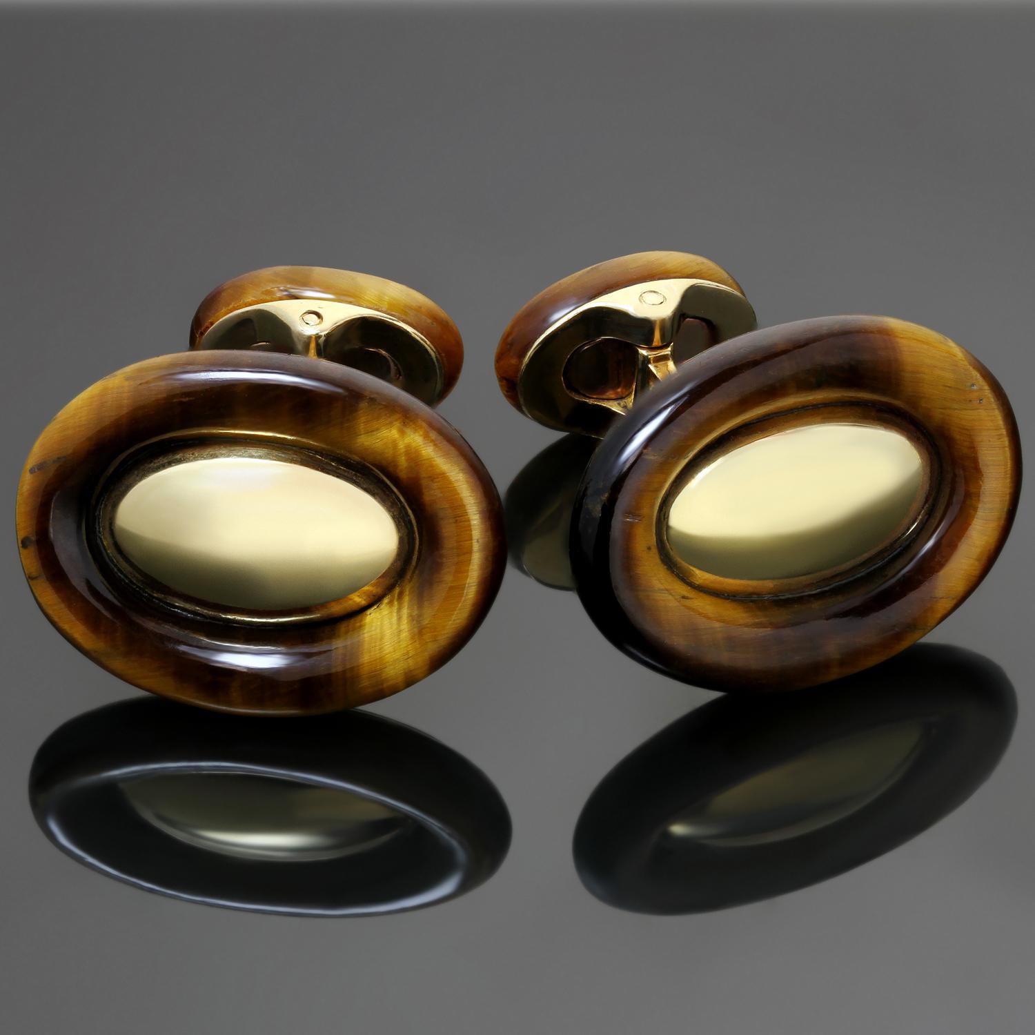 These vintage Van Cleef & Arpels cufflinks features a chic oval design crafted in 18k yellow gold and set with tiger eye stones. Made in France circa 1970s. Measurements: 0.66