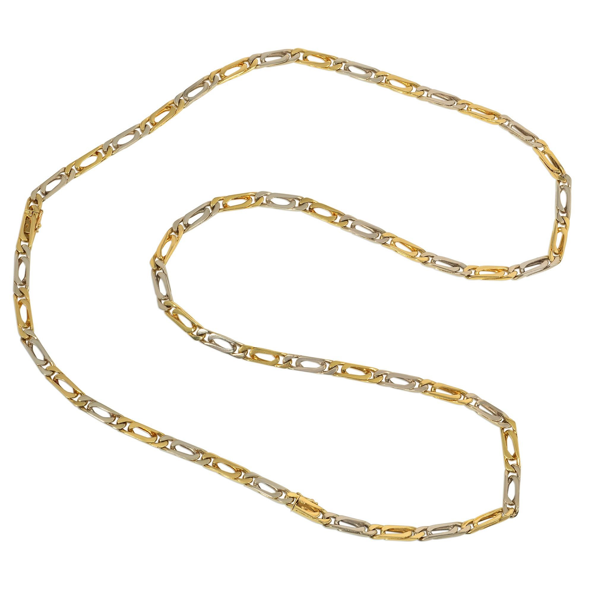 A 1970s two-color gold figaro link chain, convertible to a shorter necklace and a bracelet, in 18k white and yellow gold. Van Cleef & Arpels, France. #B4313R2.  
Total length: 35