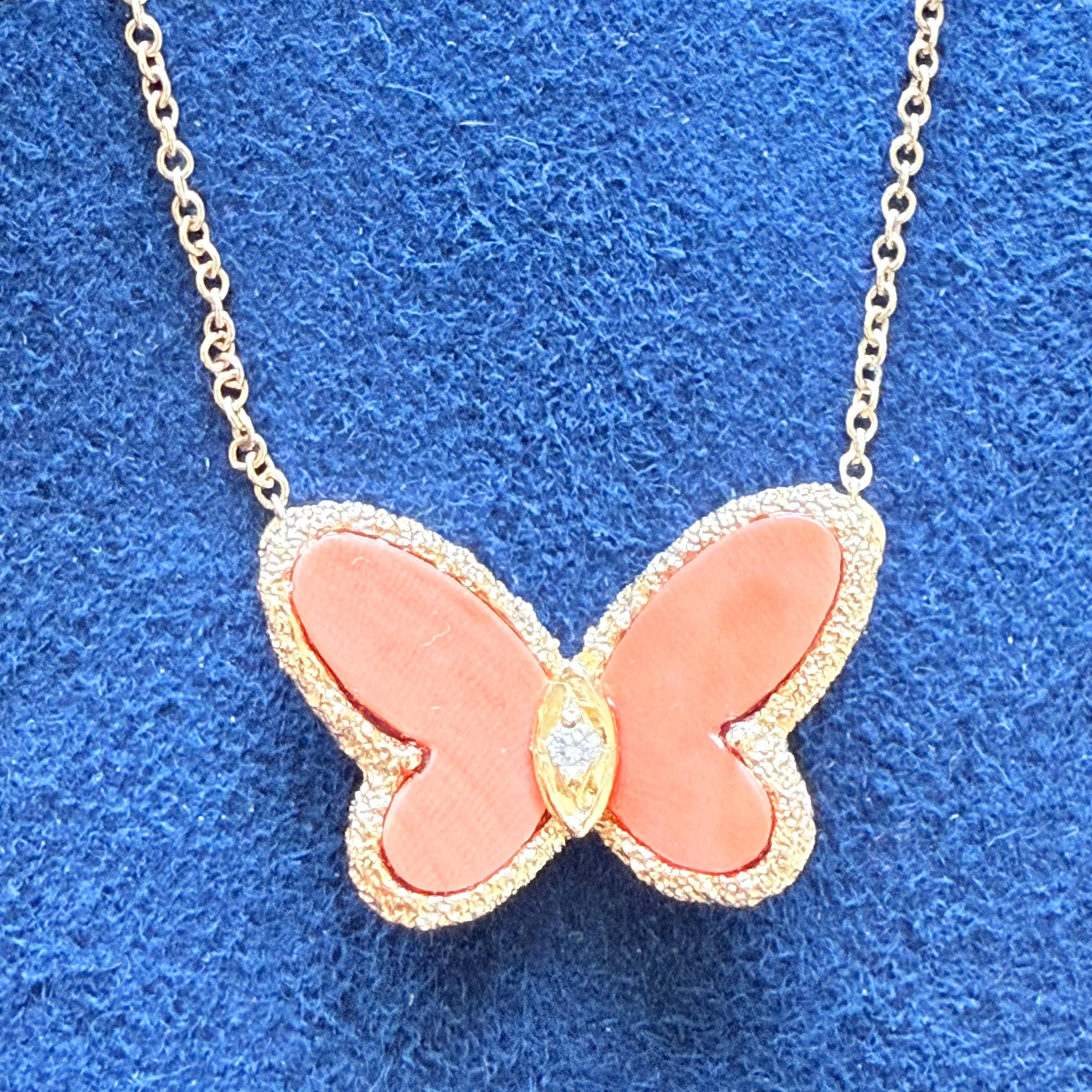 VCA Papillon necklace chain designed by Van Cleef & Arpels in the 1970's

Beautiful coral butterfly with center diamond necklace

Vintage piece, created by the jewelry house of Van Cleef & Arpels back in the early 1970's. This iconic model has been