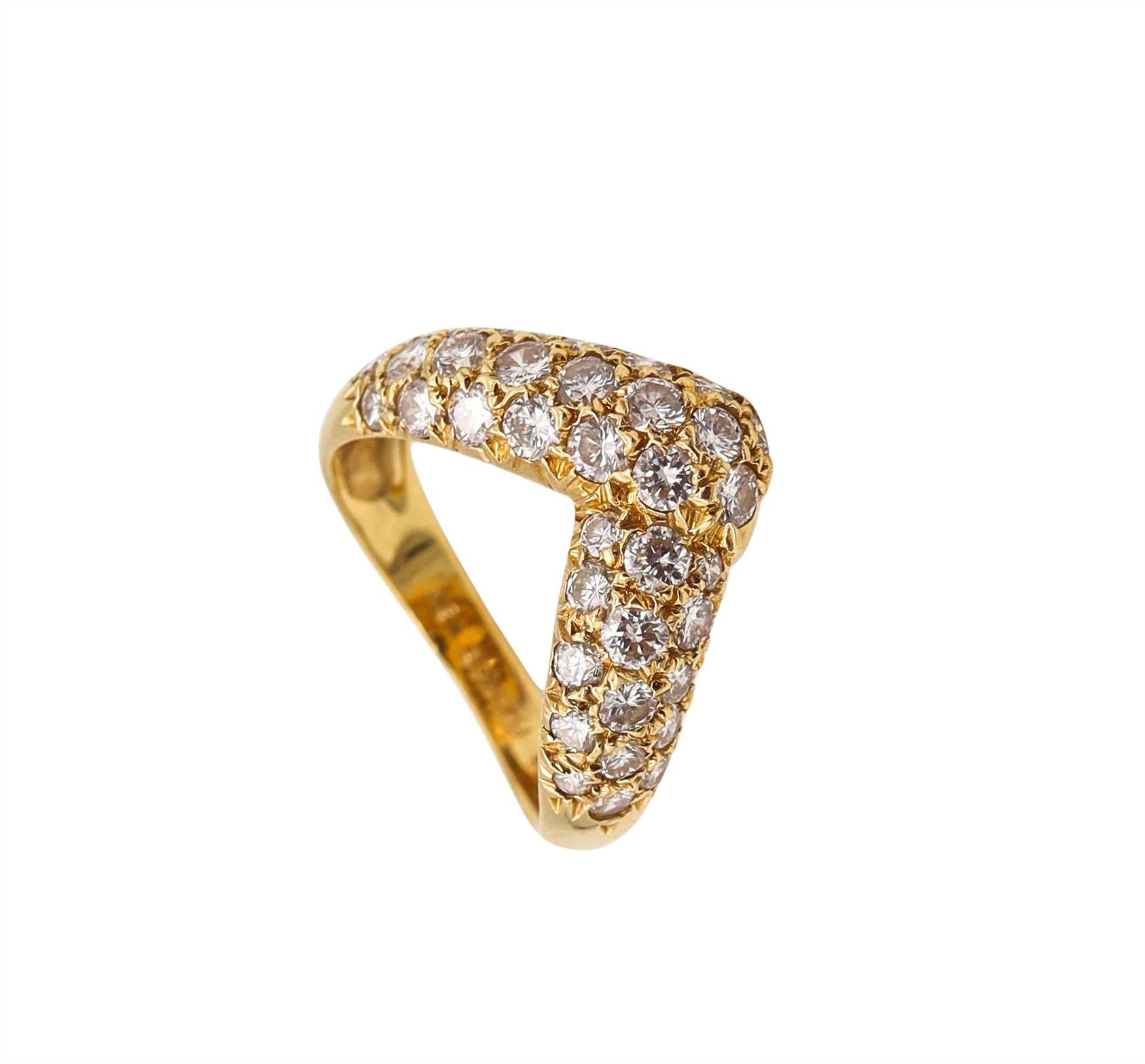 V shaped Ring designed by Van Cleef & Arpels.

An elegant everyday piece, created in Paris France by the house of Van Cleef & Arpels back in the 1970's. This sleek V shaped ring has been crafted in solid yellow gold of 18 karats, with high polished