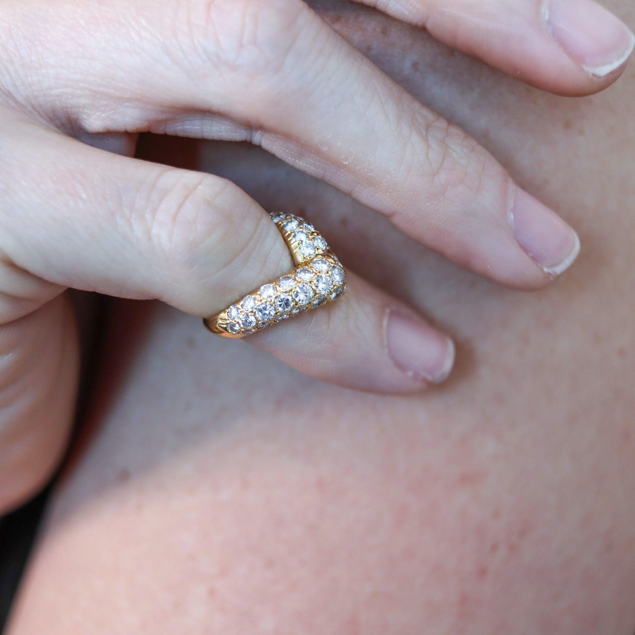 Ring designed by Van Cleef & Arpels.

This is an elegant everyday ring, created in Paris France by the jewelry house of Van Cleef & Arpels back in 1977. The sleek V shaped ring has been masterfully crafted in solid yellow gold of 18 karats with high
