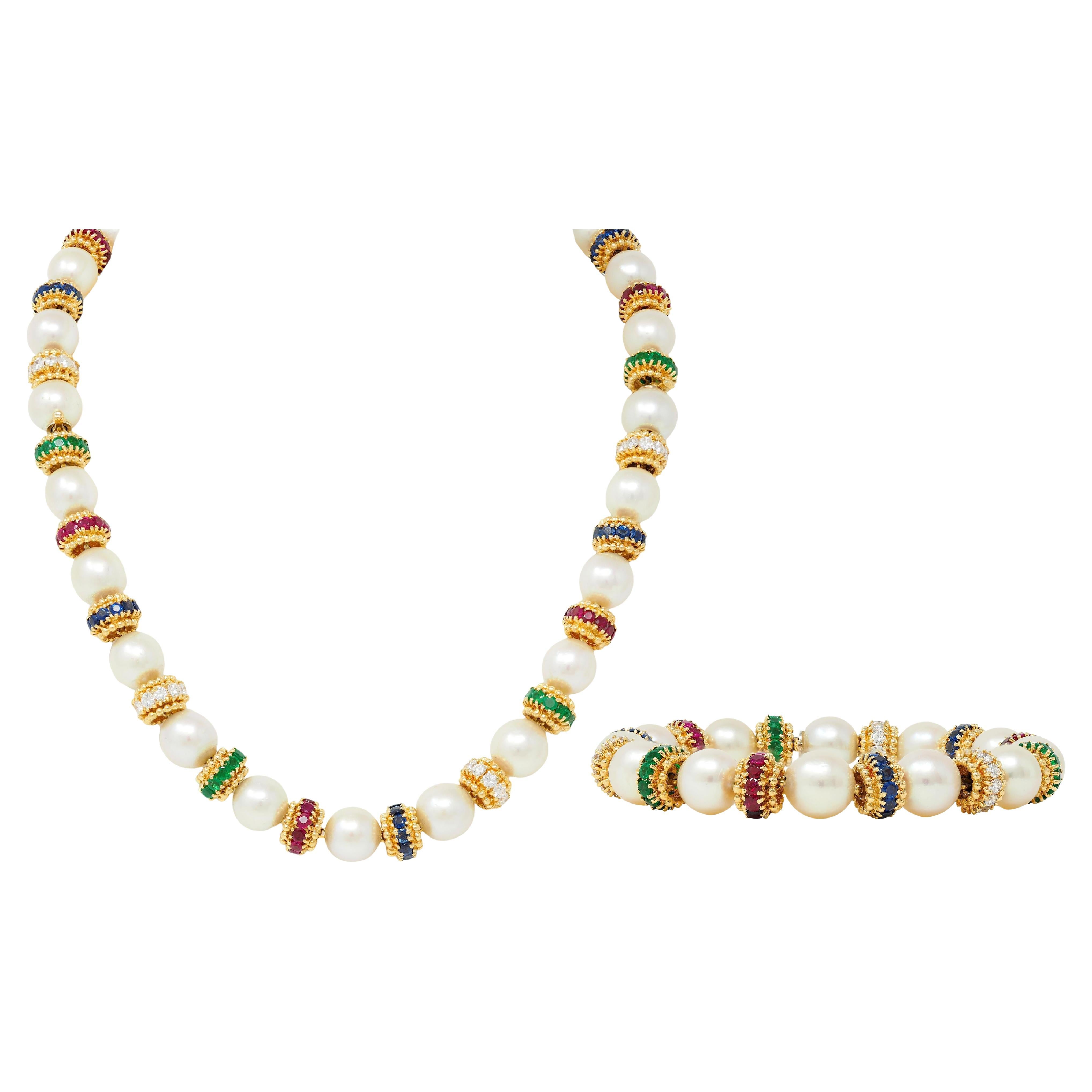 Conjunto de pulsera convertible Van Cleef
Arpels de oro de 18 quilates con perlas y piedras preciosas de los años 80