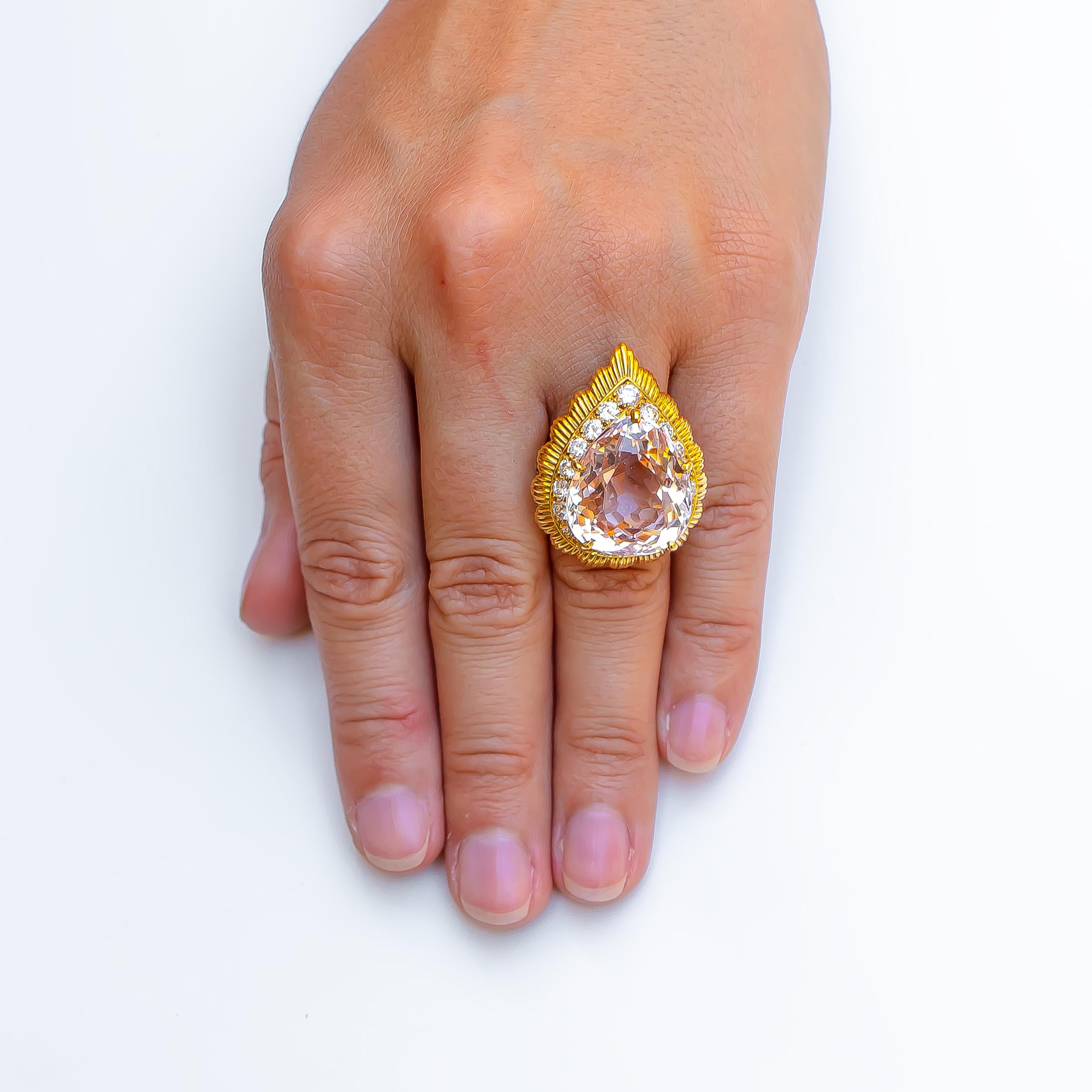 Brand: Van Cleef & Arpels (Signed)

Kunzite: 20 carats

Round Diamonds: 2.50 carats
Color: F
Clarity: VS

Metal: 18K Yellow Gold

Size: 6.5
Complimentary Resizing Available

Condition: Excellent (Previously Owned)