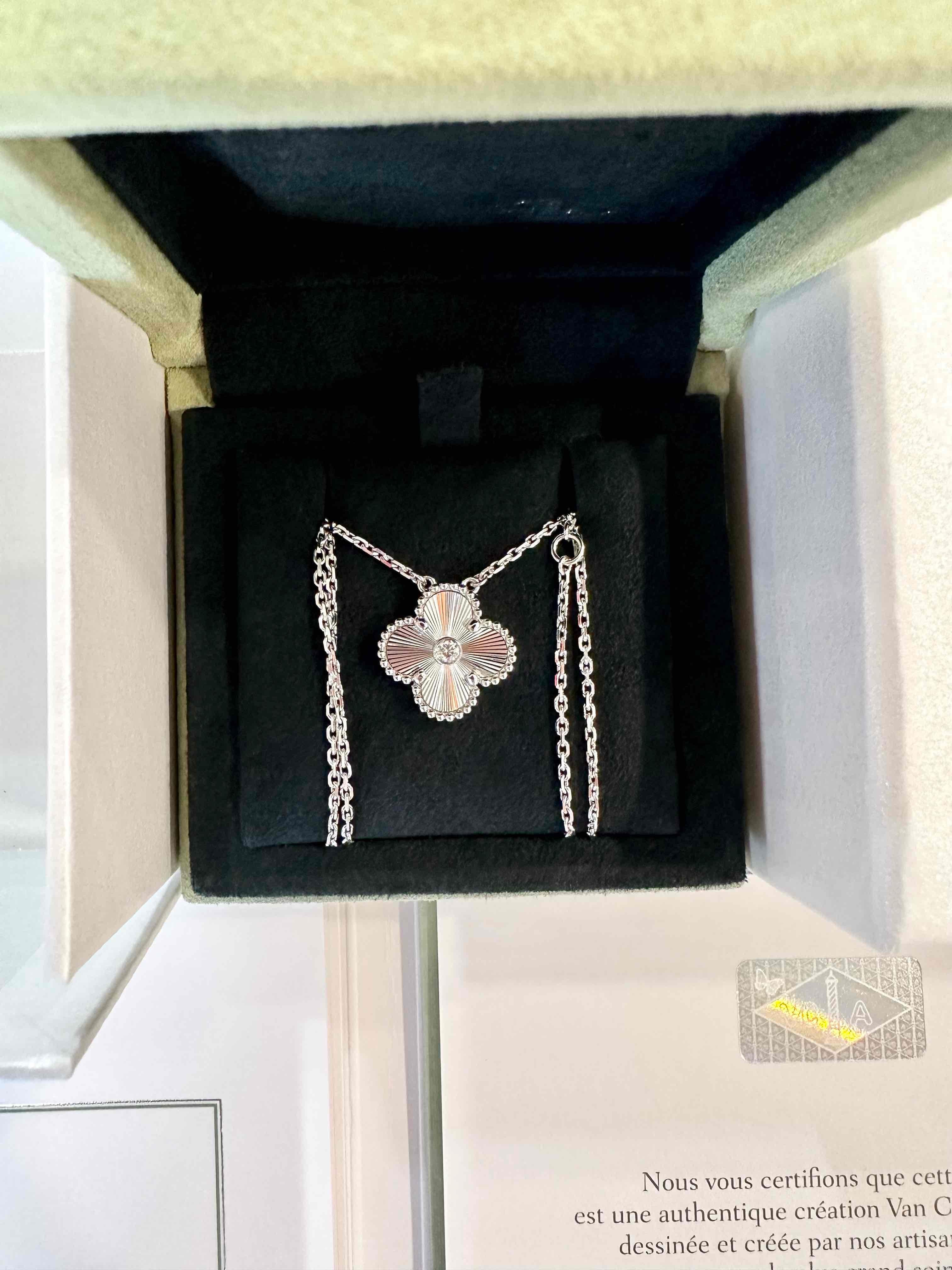 Van Cleef & Arpels 2020 Holiday Pendant of Vintage Alhambra, diamond, guilloche necklace. Discontinued hard to get on the market. 

Maker: Van Cleef & Arpels

Accessories: Boxes, the original certificate dated 2021, and the necklace.

Condition: