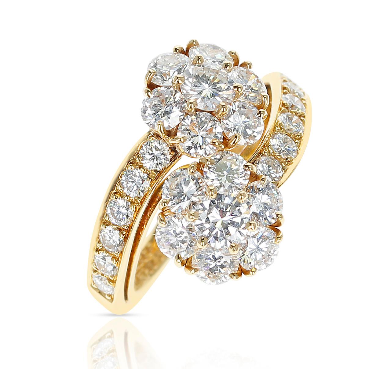 A Van Cleef & Arpels Double Fleurette Ring with approximately 2.50 ct. of Diamonds. Ring Size US 5. Total Weight: 5.45 grams. The color of the diamonds is appx. F and the clarity is VS1. 
 

