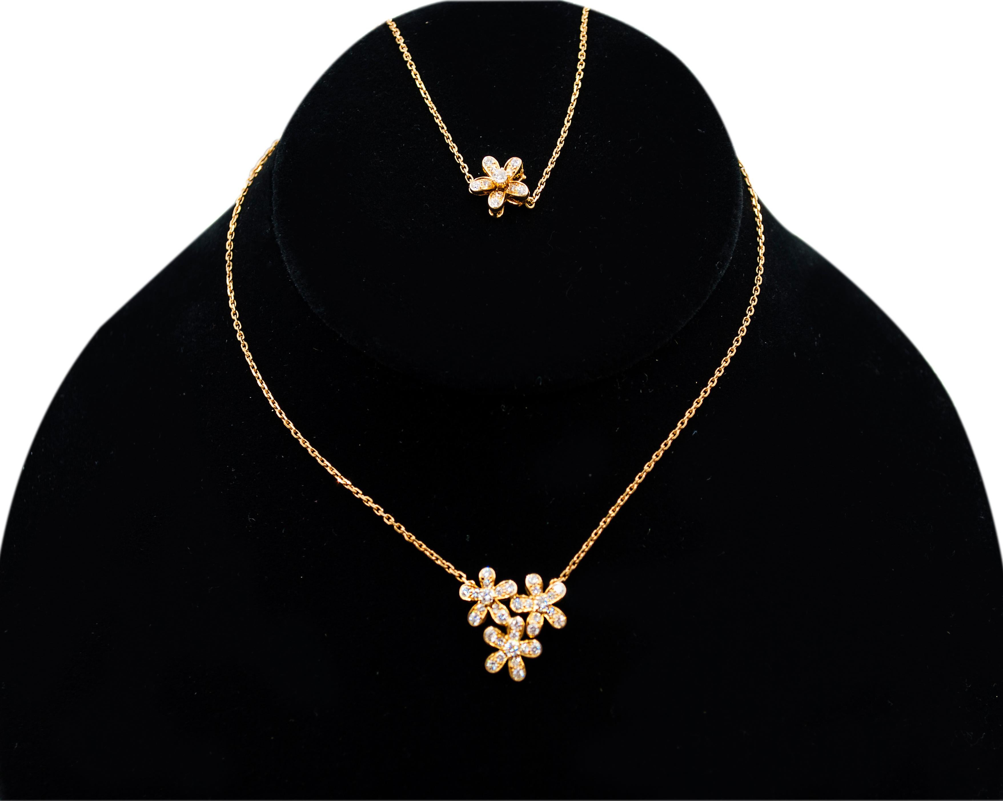 A beautiful necklace from the Van Cleef & Arpels Socrate Collection. 
Featuring 3-Flower pendant embellished with 0.91 carats of diamonds.
Made in 18K yellow gold.
