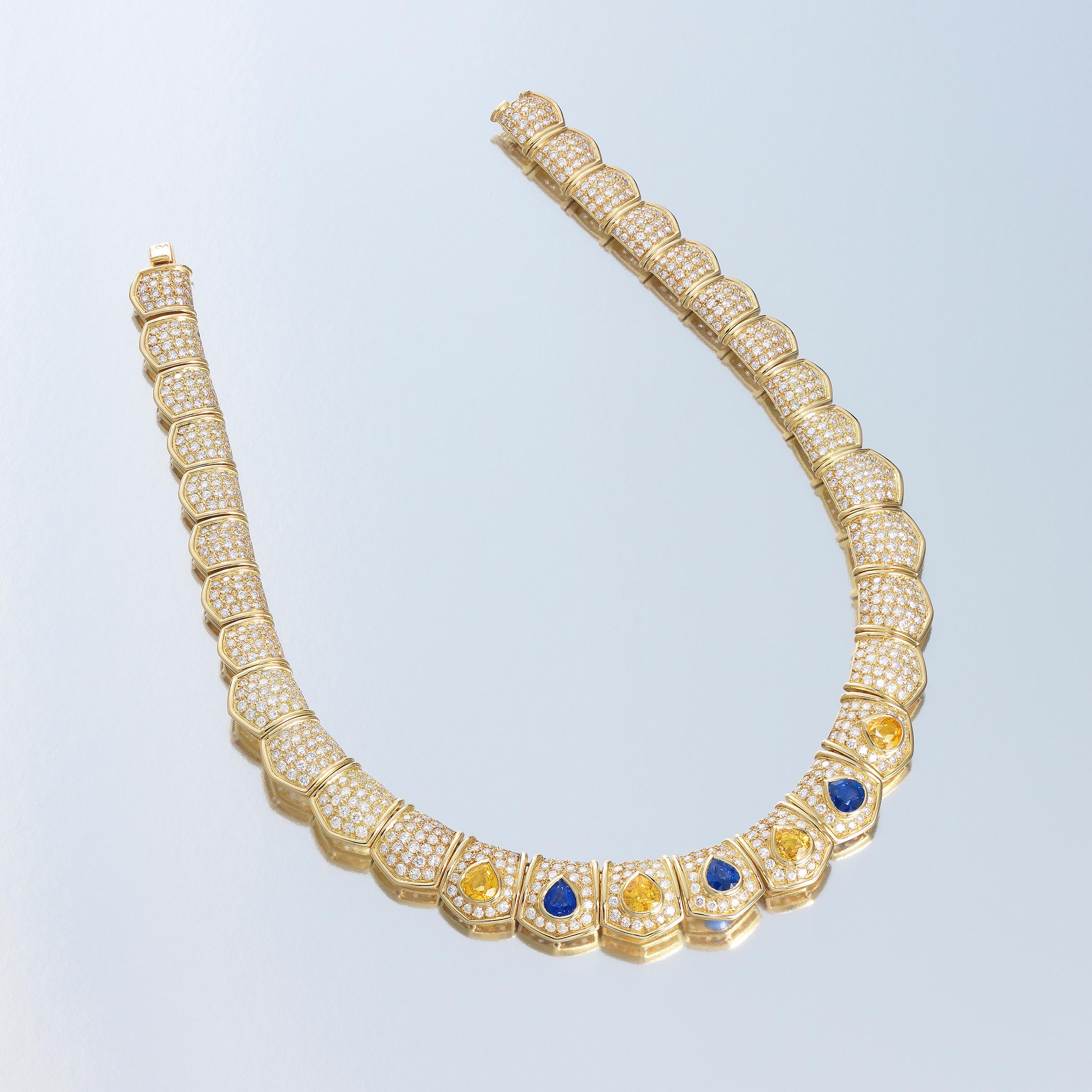 Van Cleef & Arpels dazzling collar necklace bursting with brilliance of approximately 19 carats of finest white diamonds which are complemented by 11 carats of vividly-colored blue and yellow Ceylon sapphires (GIA certified), all masterfully set in