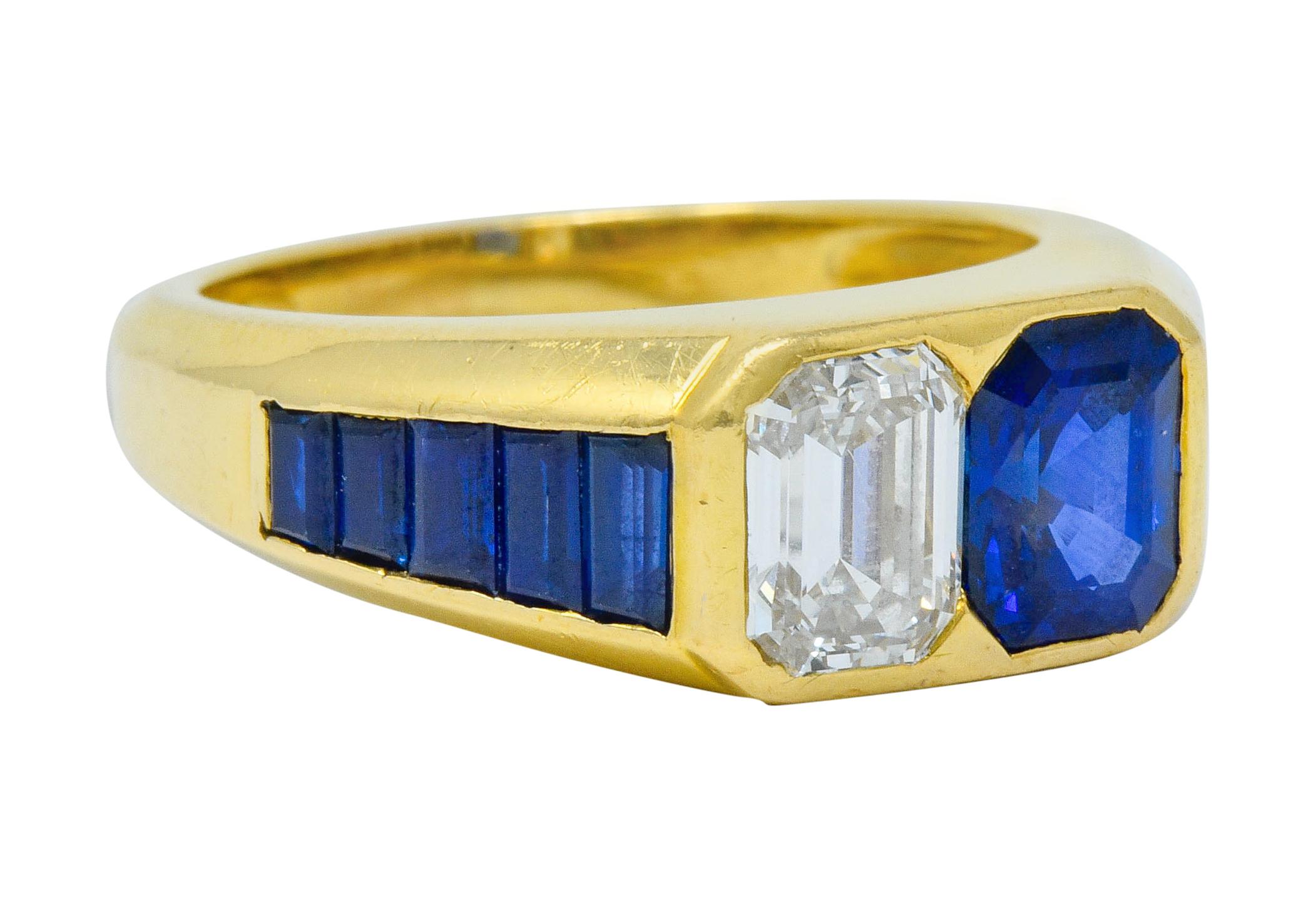Centering an emerald cut sapphire and diamond, flush set side-by-side

Flanked by channel set shoulders, one side featuring rectangular cut sapphire while other features baguette cut diamonds

Total diamond weight is 1.61 carats with G/H color and