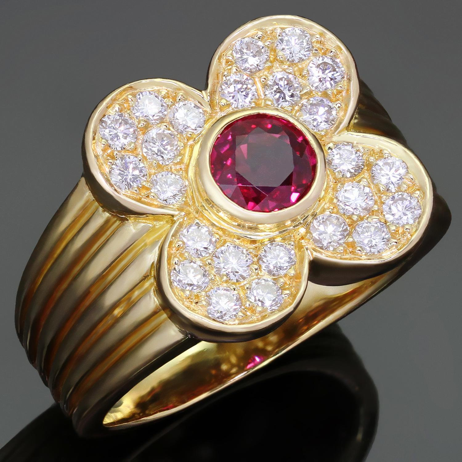 This gorgeous Van Cleef & Arpels ring features the lucky four-leaf clover design crafted in 18k yellow gold and set with a genuine round red ruby of an estimated 0.78 carats surrounded with brilliant-cut round D-F VVS1-VVS2 diamonds of an estimated