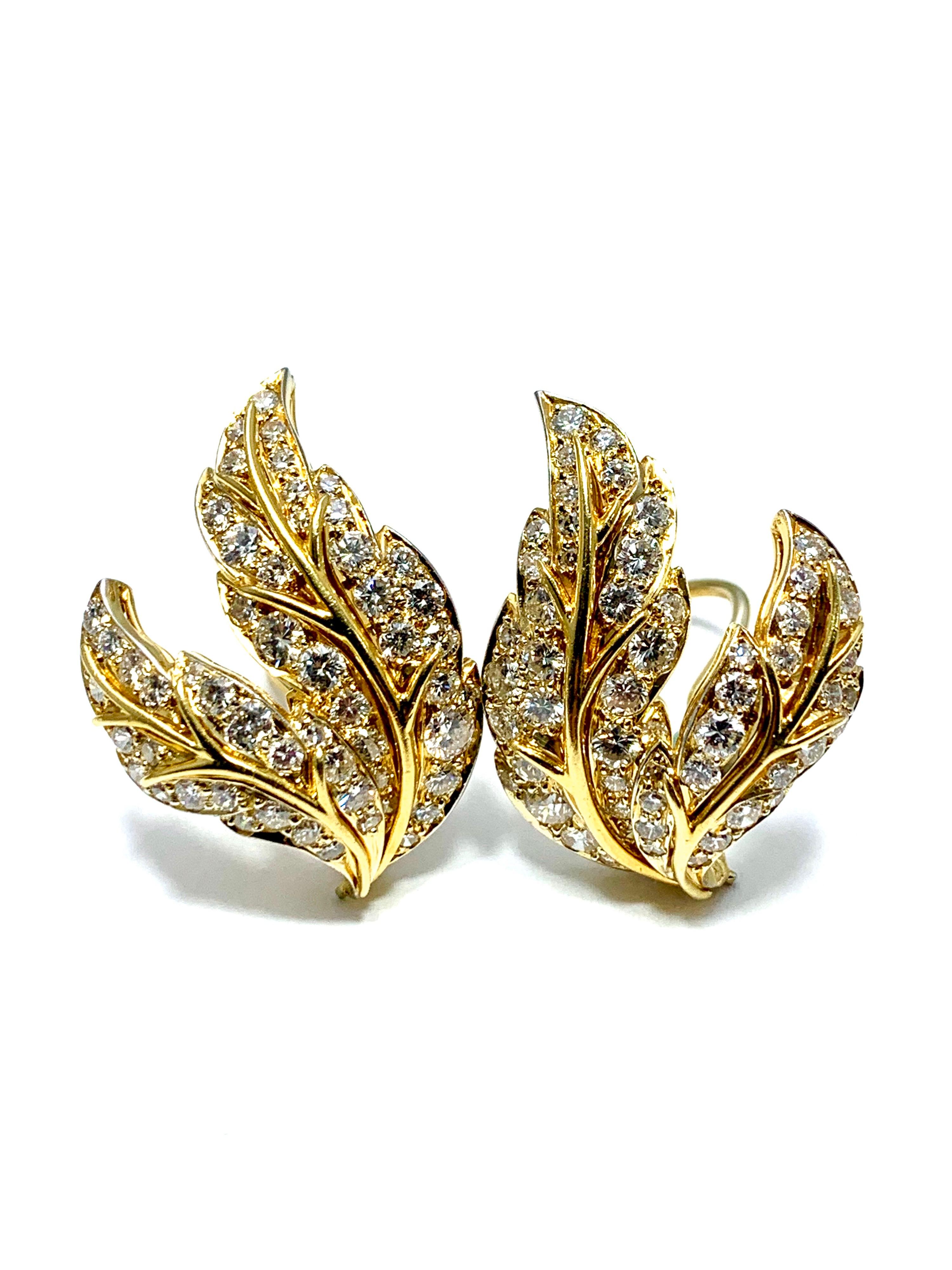 A show stopping pair of Van Cleef & Arpels Diamond and 18k yellow gold leaf earrings.  The 110 round cut Diamonds combine for a total weight of 4.28 carats.  They are graded as E-F color, VVS2-VS1 clarity.  The leaf design is intricately detailed
