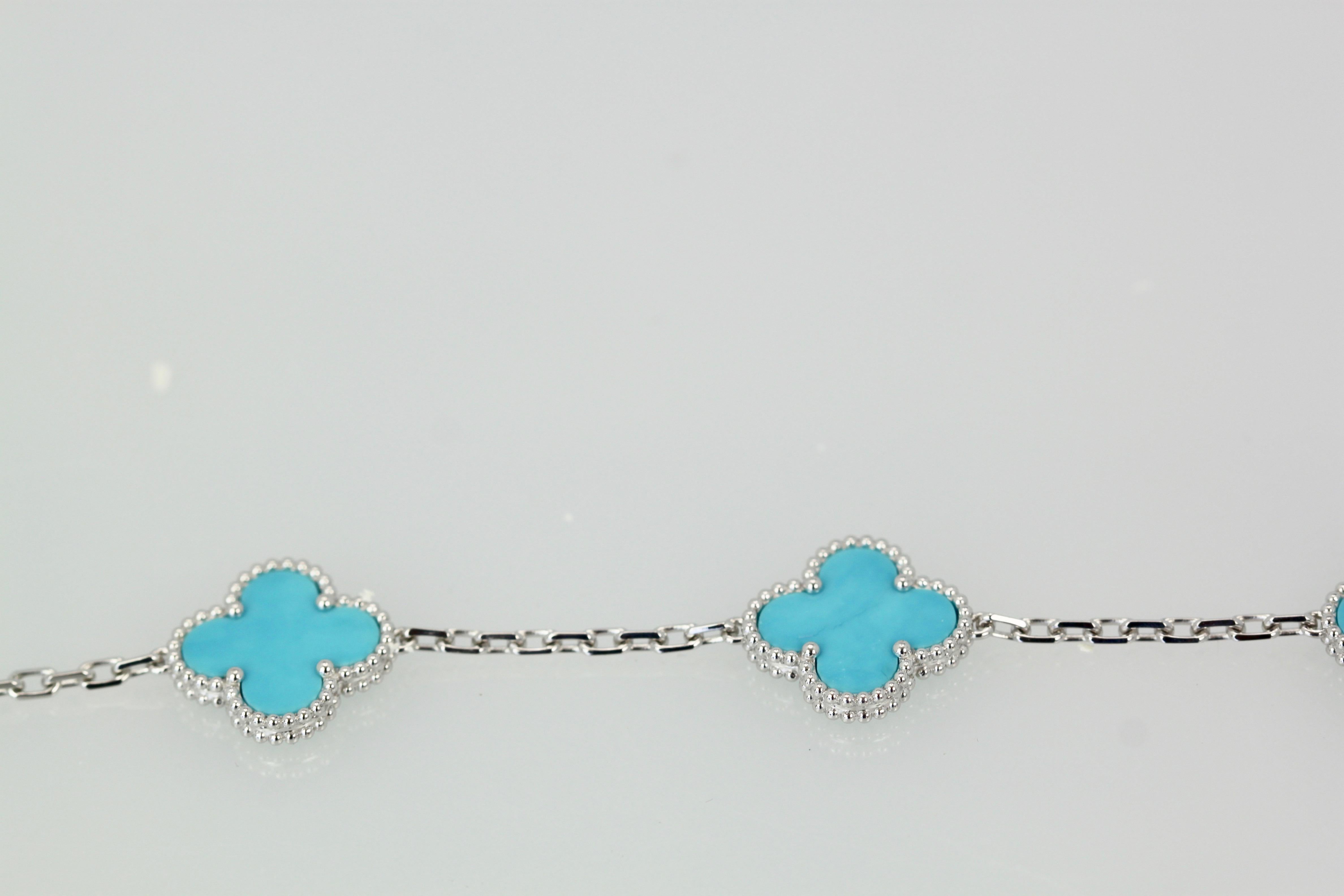 This Alhambra 5 clover bracelet is made in 18K white gold and gorgeous Persian Turquoise, which they no longer make. Since this is in white gold it is more coveted than yellow gold which is common this will not last long. This bracelet is in near