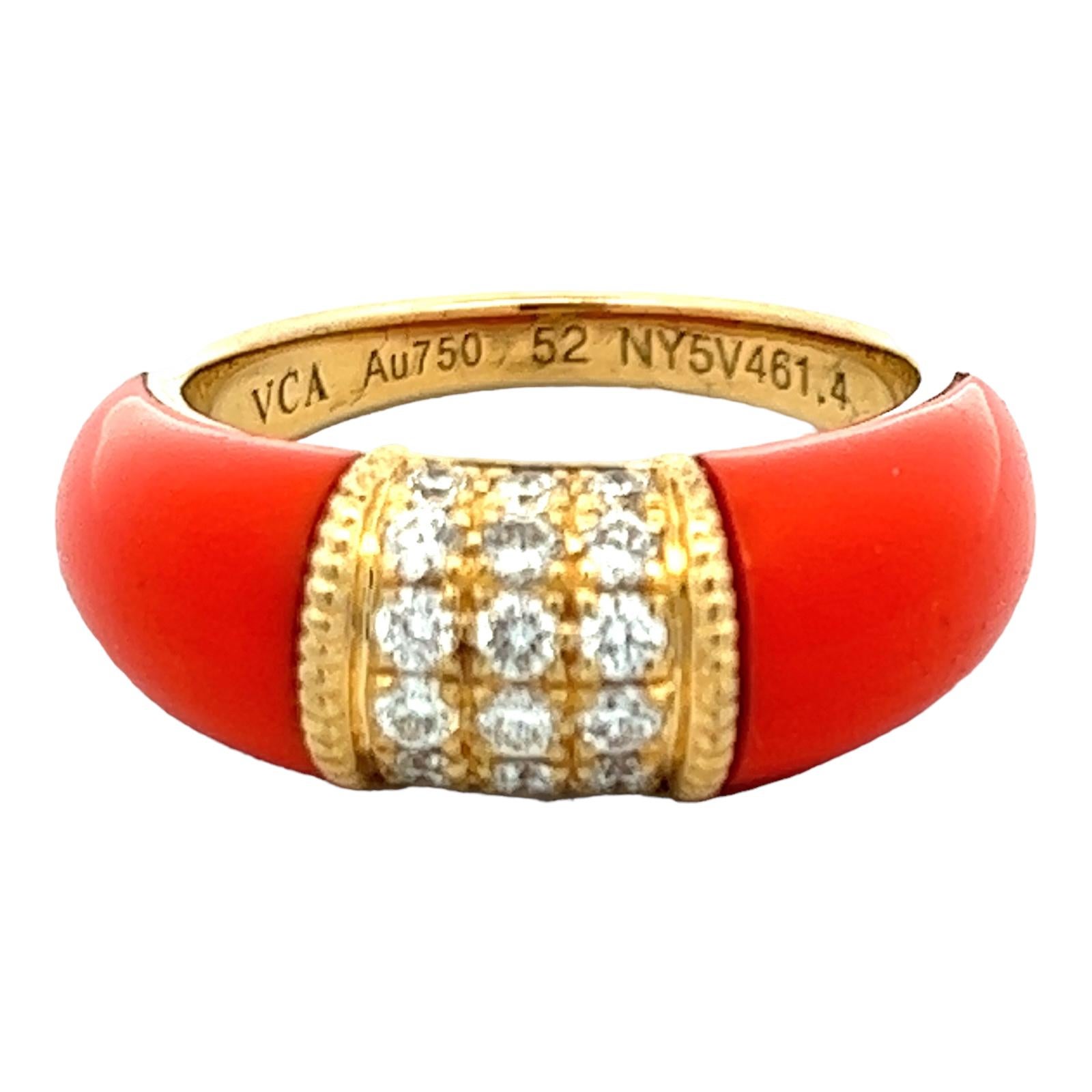 Van Cleef & Arpels 6 row diamond and coral inlay ring crafted in 18 karat yellow gold. The ring circa 1960's features two pieces of coral inlay with 18 round brilliant cut diamonds set in the center. The ring is size 52 (US size 6.5) and measures