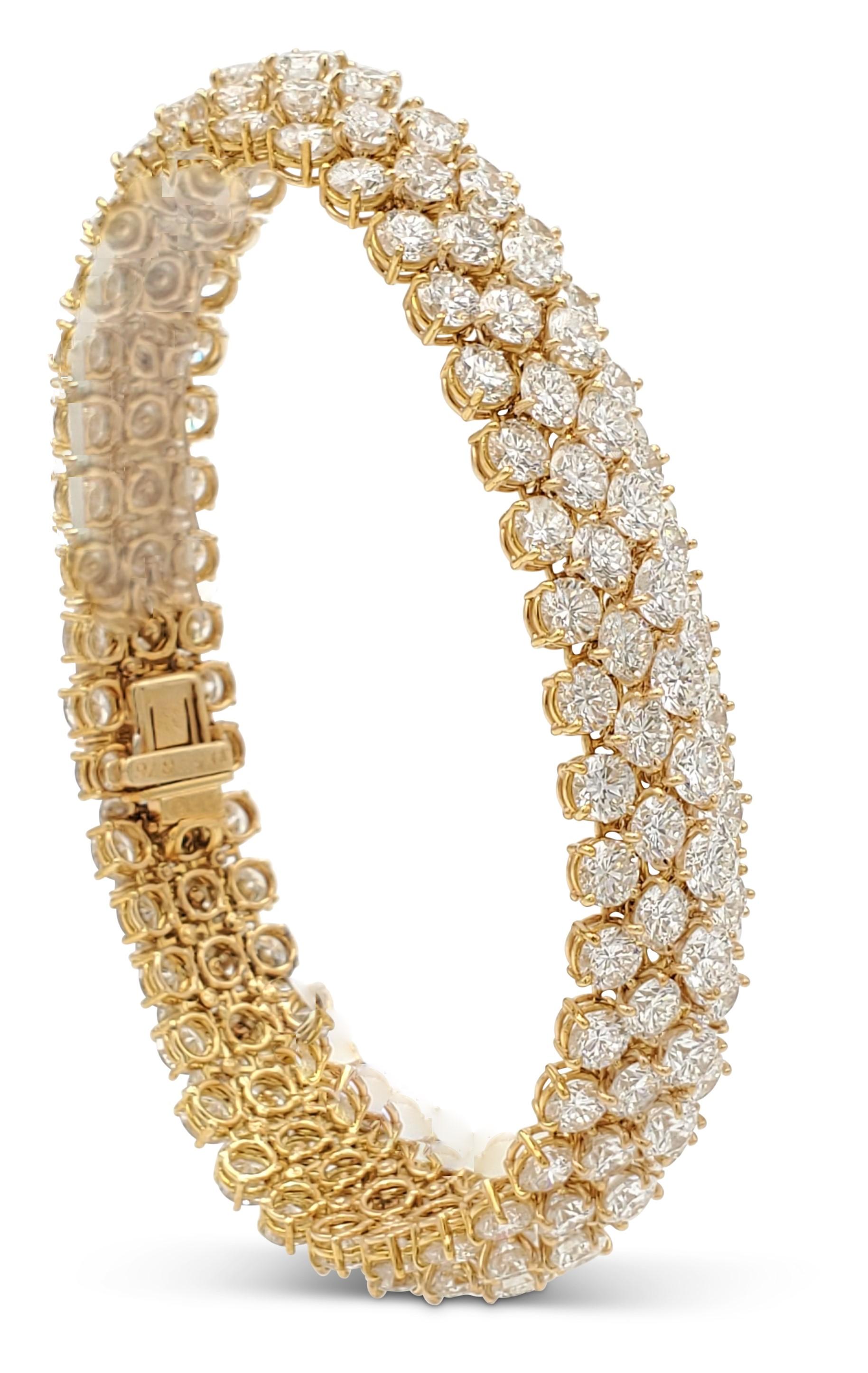 Impressive Van Cleef & Arpels Á Cheval five-row diamond bracelet crafted in 18 karat yellow gold and set with an estimated 51.0 carats of high-quality round brilliant cut diamonds (E-F color, VS clarity). Signed VCA, with serial number and