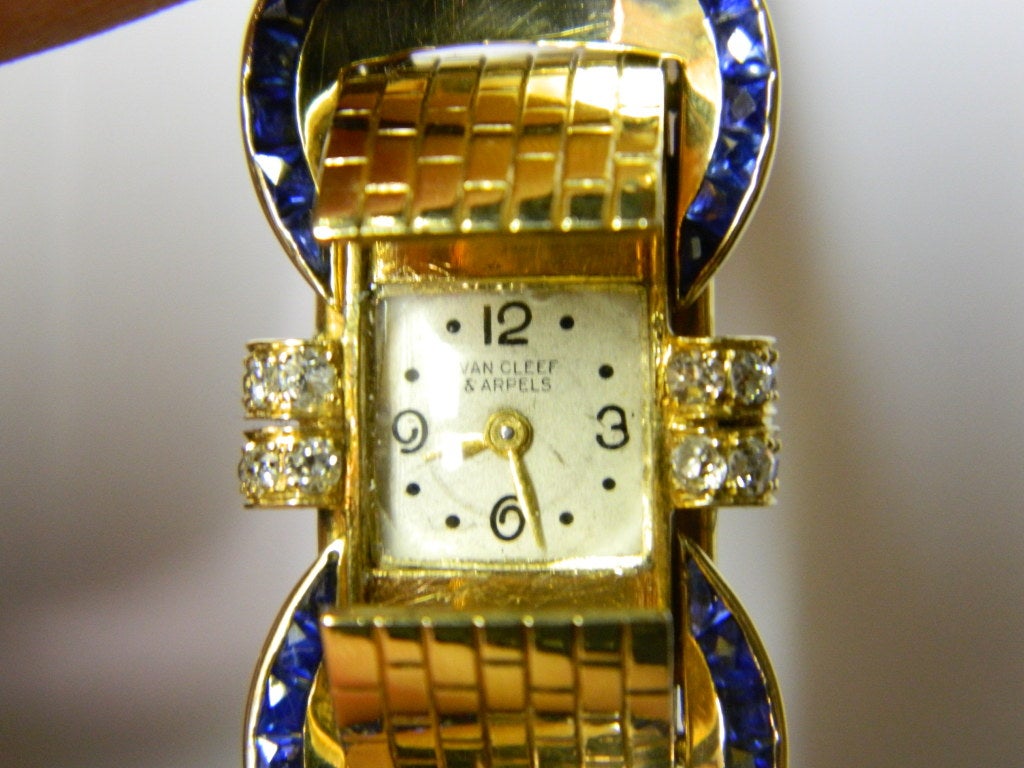 A sophisticated bracelet watch, manufactured by Van Cleef & Arpels in the late 1940s, presenting small diamonds and sapphires on an 18k yellow gold mounting. The watch is functioning and carries a Van Cleef movement.