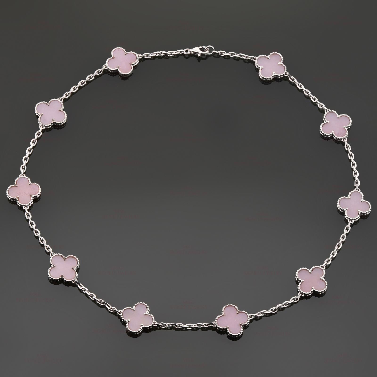 This splendid Van Cleef & Arpels necklace from the iconic Alhambra collection is crafted in 18k white gold and features 10 lucky clover motifs inlaid with natural pink opal in round bead settings. This extremely rare necklace has been discontinued