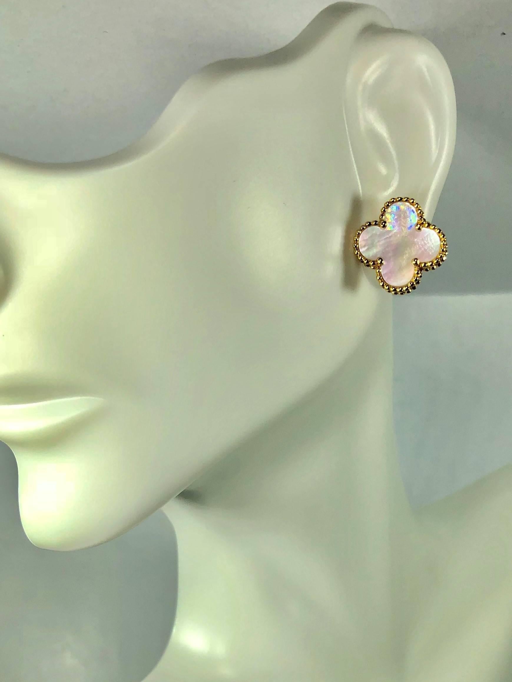 Van Cleef and Arpels Alhambra 18 karat and Mother of Pearl earrings. Alhambra collection Van Cleef and Arpels classic Mother of pearl set in 18 karat yellow gold weighing 4.2 grams,2.7dwt.. The earrings are hallmarked VCA 750, JB 067438 on the back