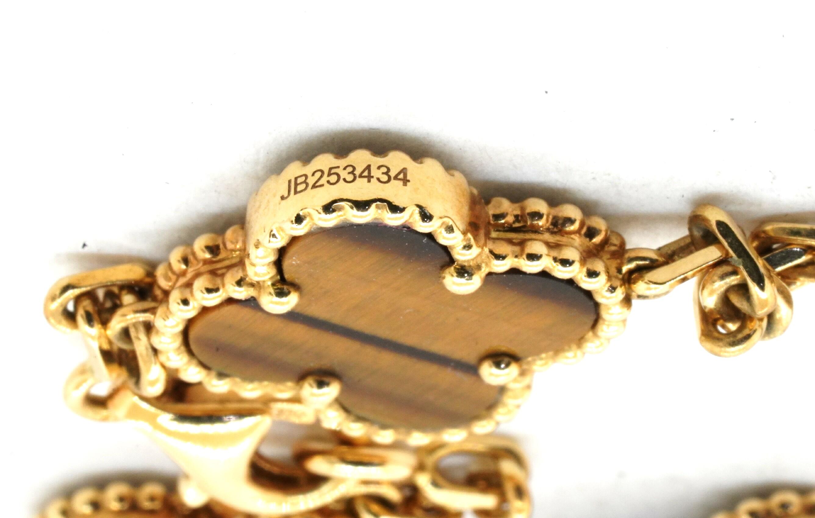 Modern Van Cleef & Arpels Alhambra 18K Elegant Tigers Eye 10-Charm Necklace w/ Box For Sale