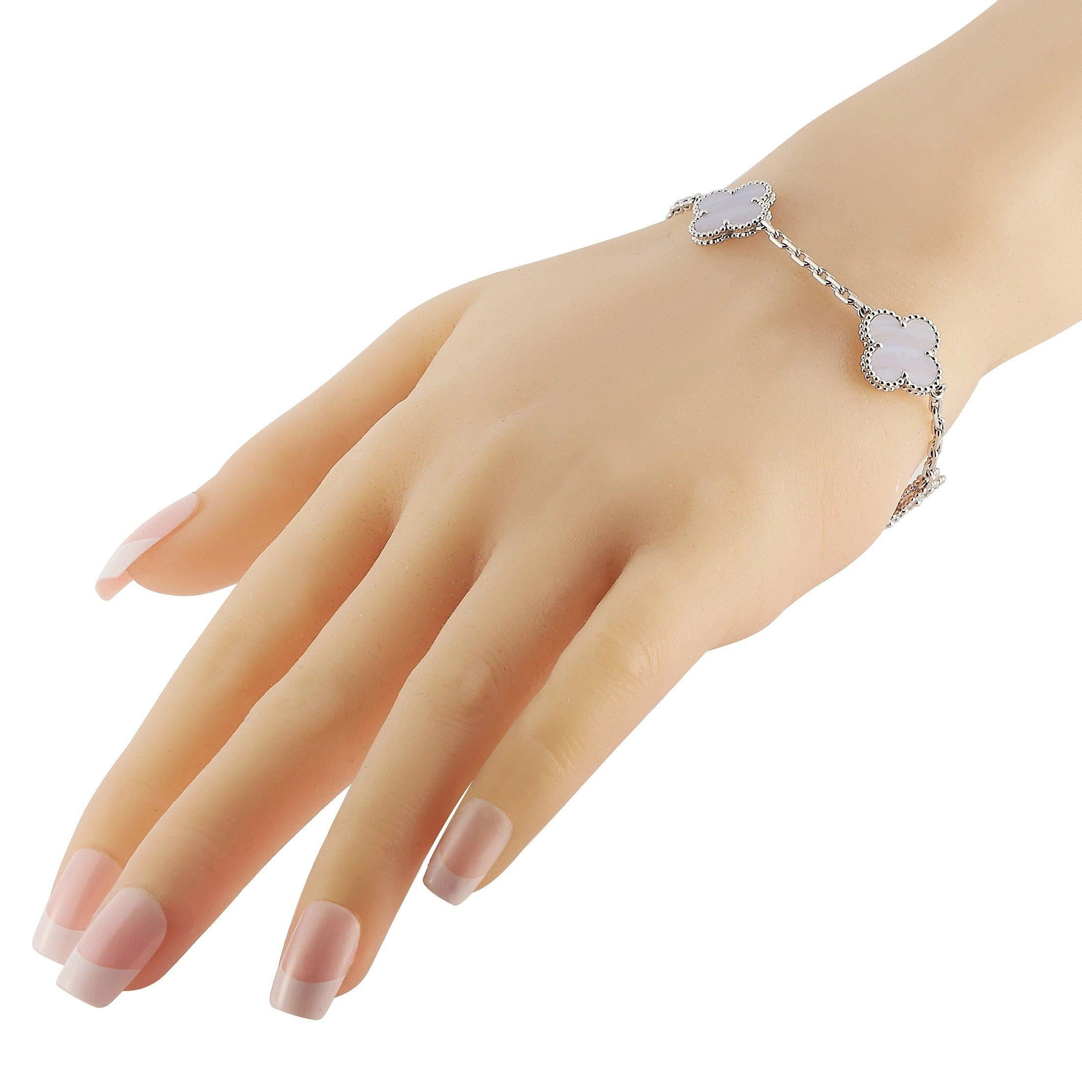 The Van Cleef & Arpels iconic Alhambra symbol makes this vintage bracelet incredibly iconic. Each clover-shaped charm is accented by Chalcedony and comes complete with delicate millegrain details. This piece is crafted from 18K White Gold and