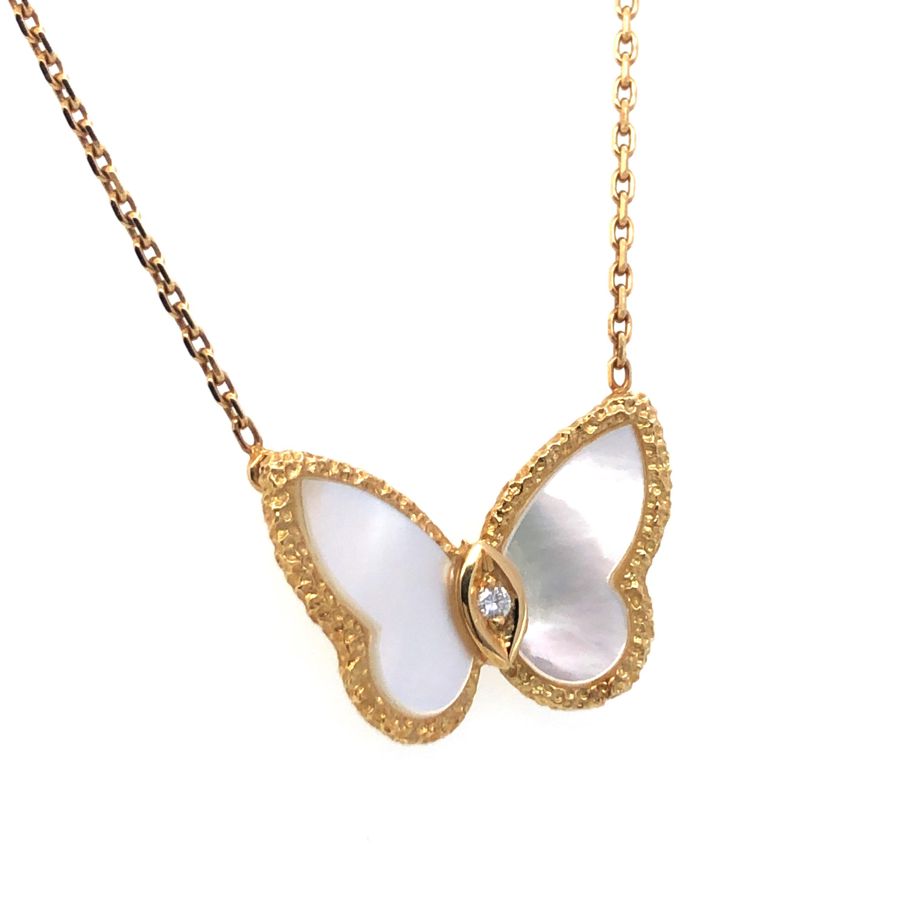 This charming necklace by Van Cleef & Arpels in 18 karat yellow gold is set with two butterfly shaped mother-of-pearl elements and 1 brilliant-cut diamond of F/G colour and vvs clarity, weight 0.03 carats.

Maker's mark: VCA
Assay mark: 750 and