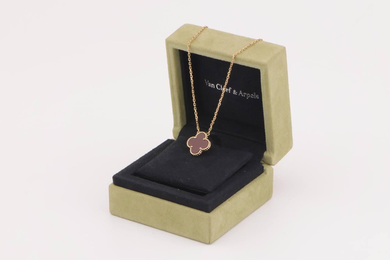 A classic Van Cleef & Arpels Alhambra carnelian pendant necklace. 

This is the kind of piece that will become a staple of your jewellery collection. You will find yourself reaching for it time after time. It will go with almost any outfit and add a