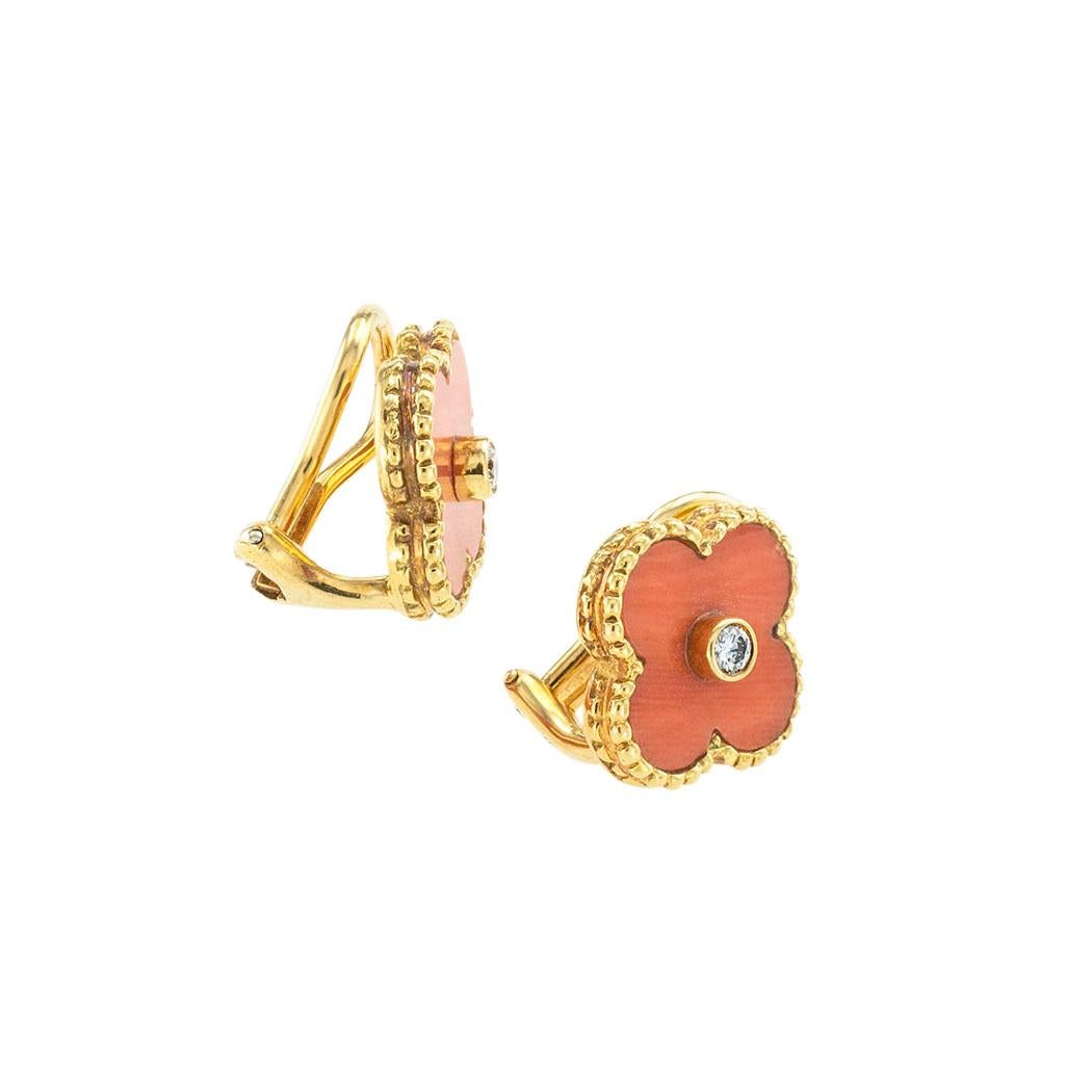 Van Cleef & Arpels coral diamond and yellow gold Alhambra clip-on earrings. *

SPECIFICATIONS:

DIAMONDS:  two round brilliant-cut diamonds totaling approximately 0.10 carat, approximately F-G color, VVS clarity.

GEMSTONES:  orange-red