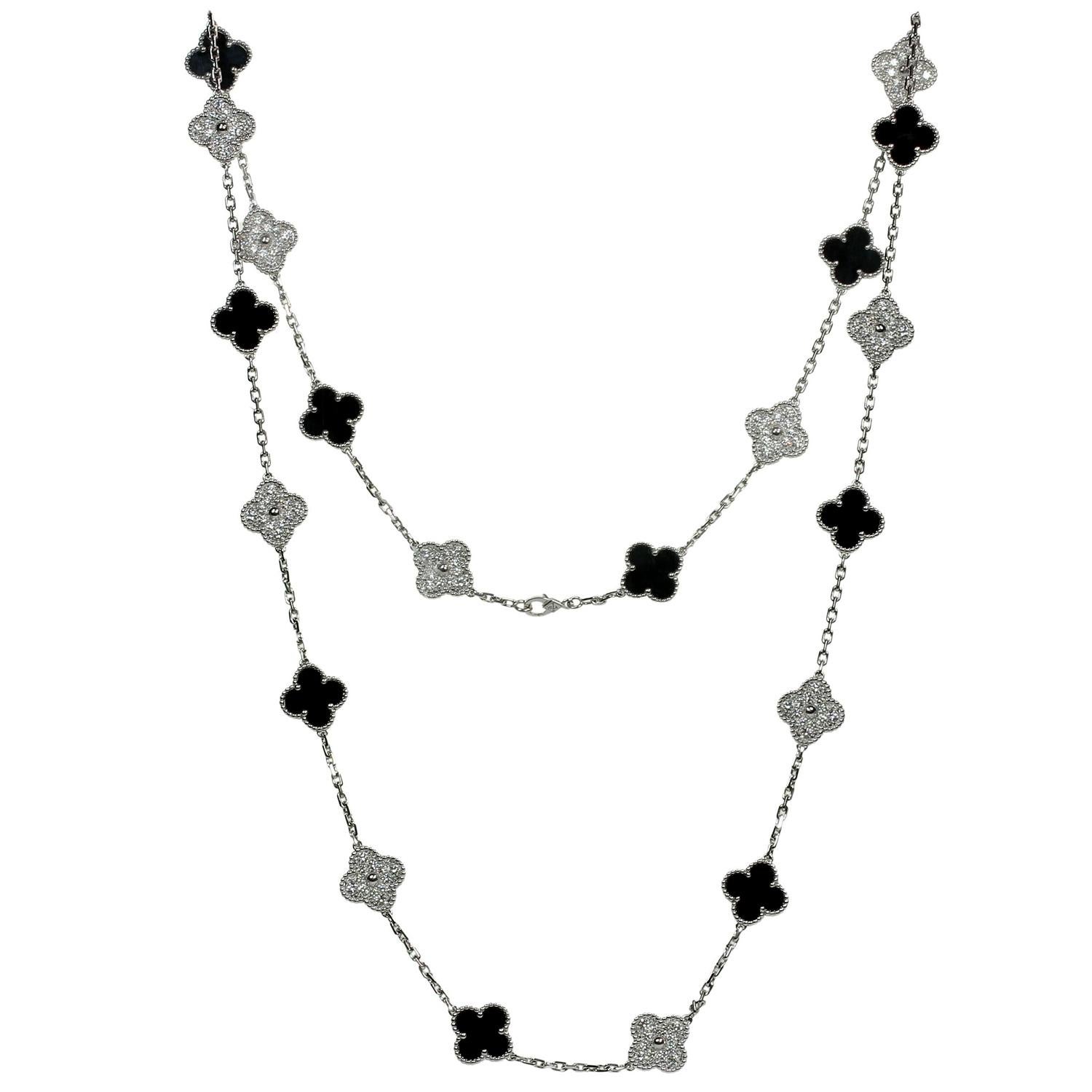This exquisite long Van Cleef & Arpels necklace from the classic Alhambra collection features 20 lucky clover motifs crafted in 18k white gold, 10 are set with black onyx and 10 are pave-set with 120 round brilliant D-E-F VVS1-VVS2 diamonds weighing