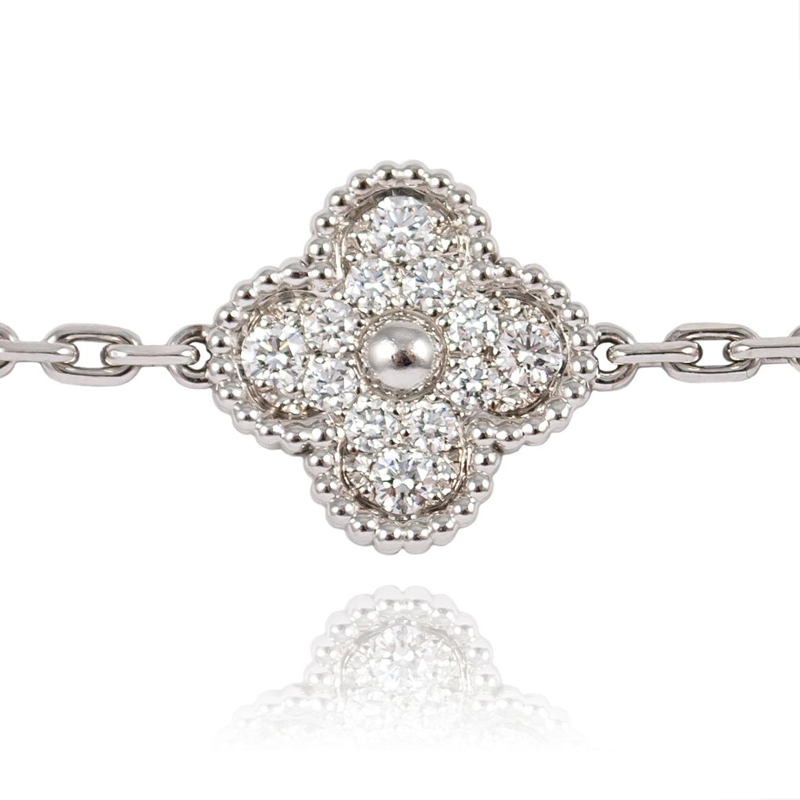 This Van Cleef & Arpels Alhambra bracelet is the essence of sophistication. Inspired by the clover leaf, these icons of luck are adorned with a border of gold beads featuring pave set brilliant round diamonds. 

With 5 motifs in 18K White Gold, this
