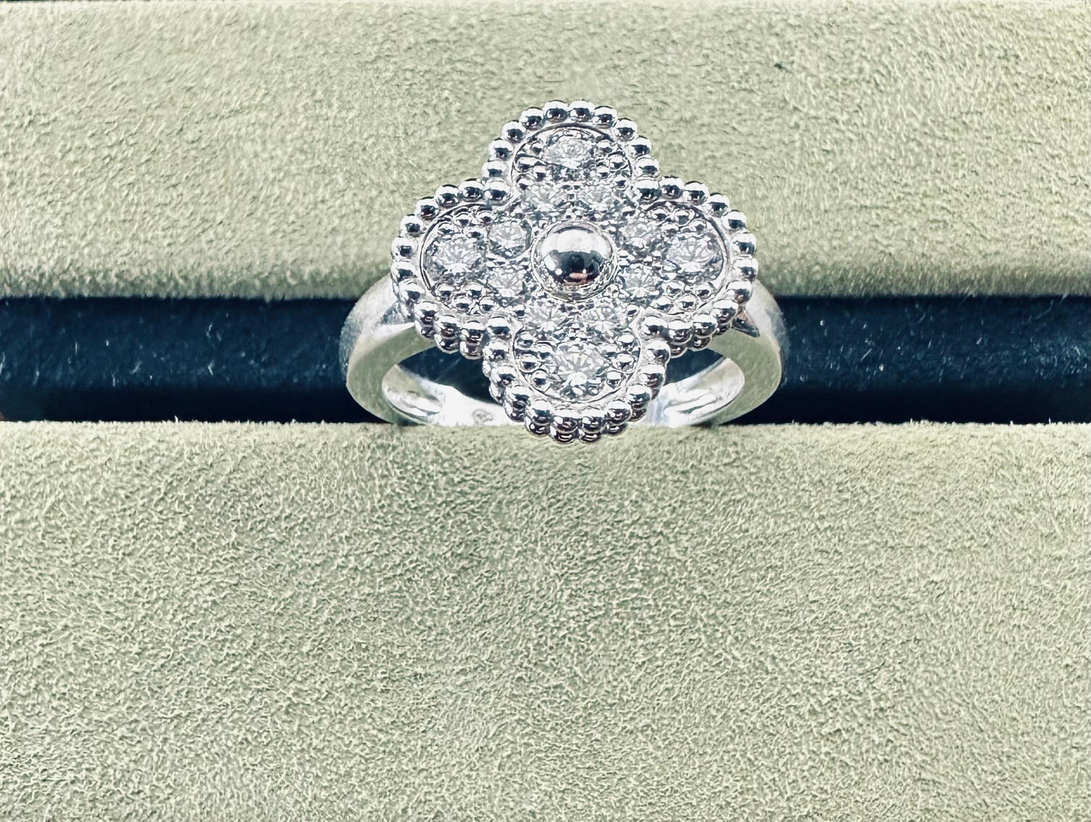Vintage Alhambra ring, rhodium plated 18K white gold, round diamonds; diamond quality DEF, IF to VVS.
12 Round Brilliant Cut .48 cts
18k White Gold 
size 54
