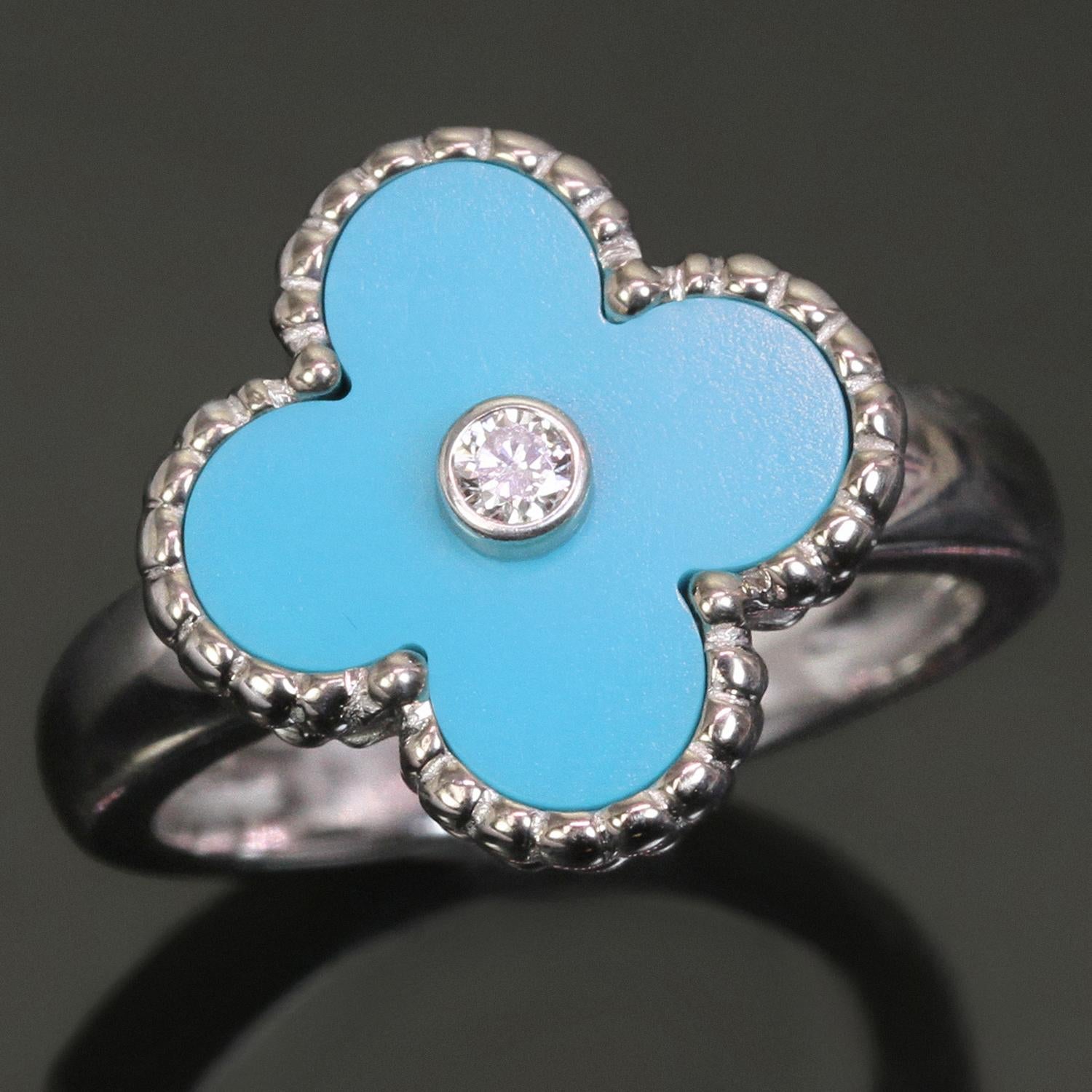 This fabulous Van Cleef & Arpels ring from the iconic Alhambra collection features the lucky clover design crafted in 18k white gold, inlaid with blue turquoise and accented with a bezel-set brilliant-cut round D-E-F VVS1-VVS2 diamond weighing an