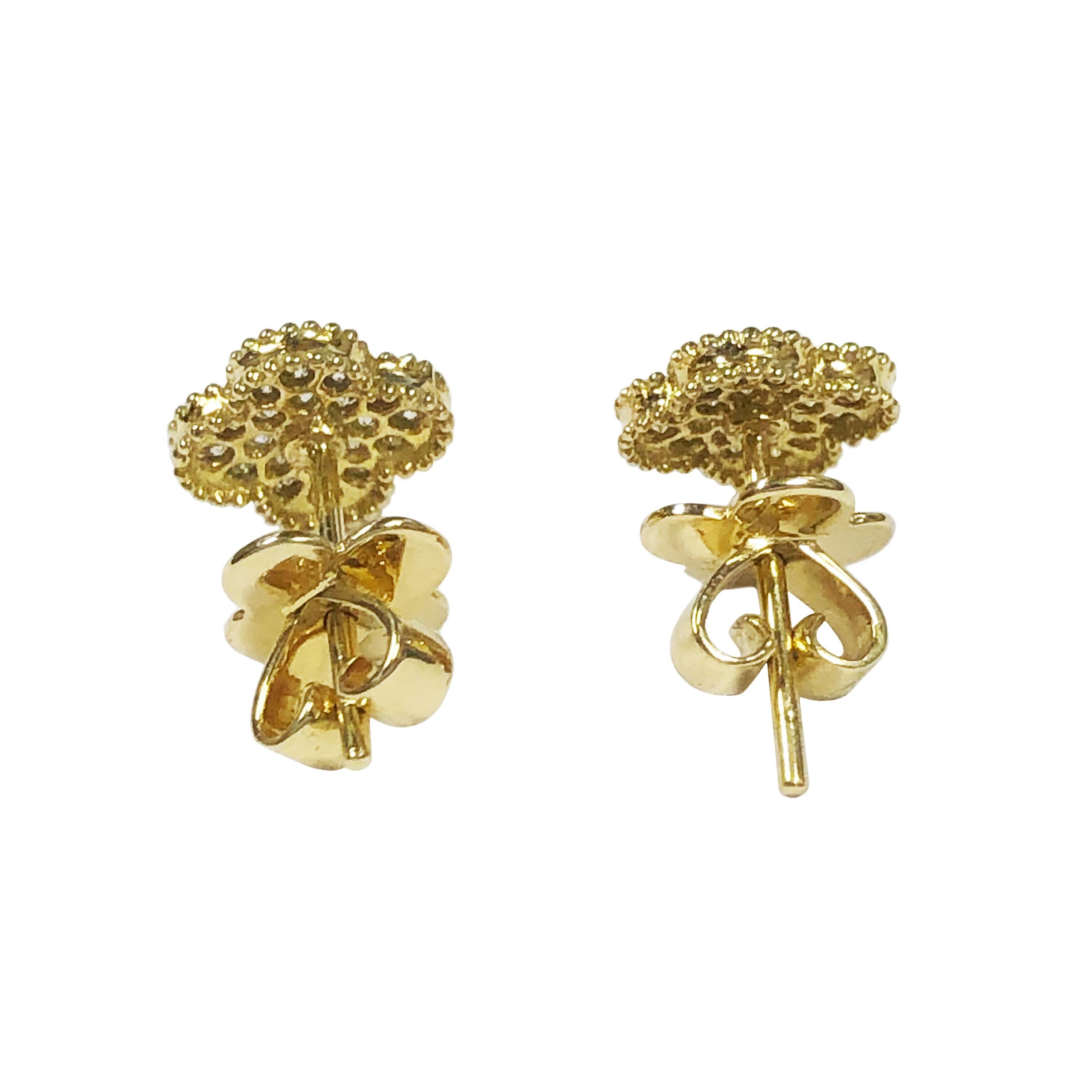 Circa 2015 Van Cleef & Arpels Classic Vintage collection Alhambra Stud Earrings, 18K Yellow Gold and Measuring 3/8 X 3/8 Inch and set with 42 Round Brilliant cut Diamonds totaling 1/2 Carat. Post Backs and come in the original VCA Presentation box.