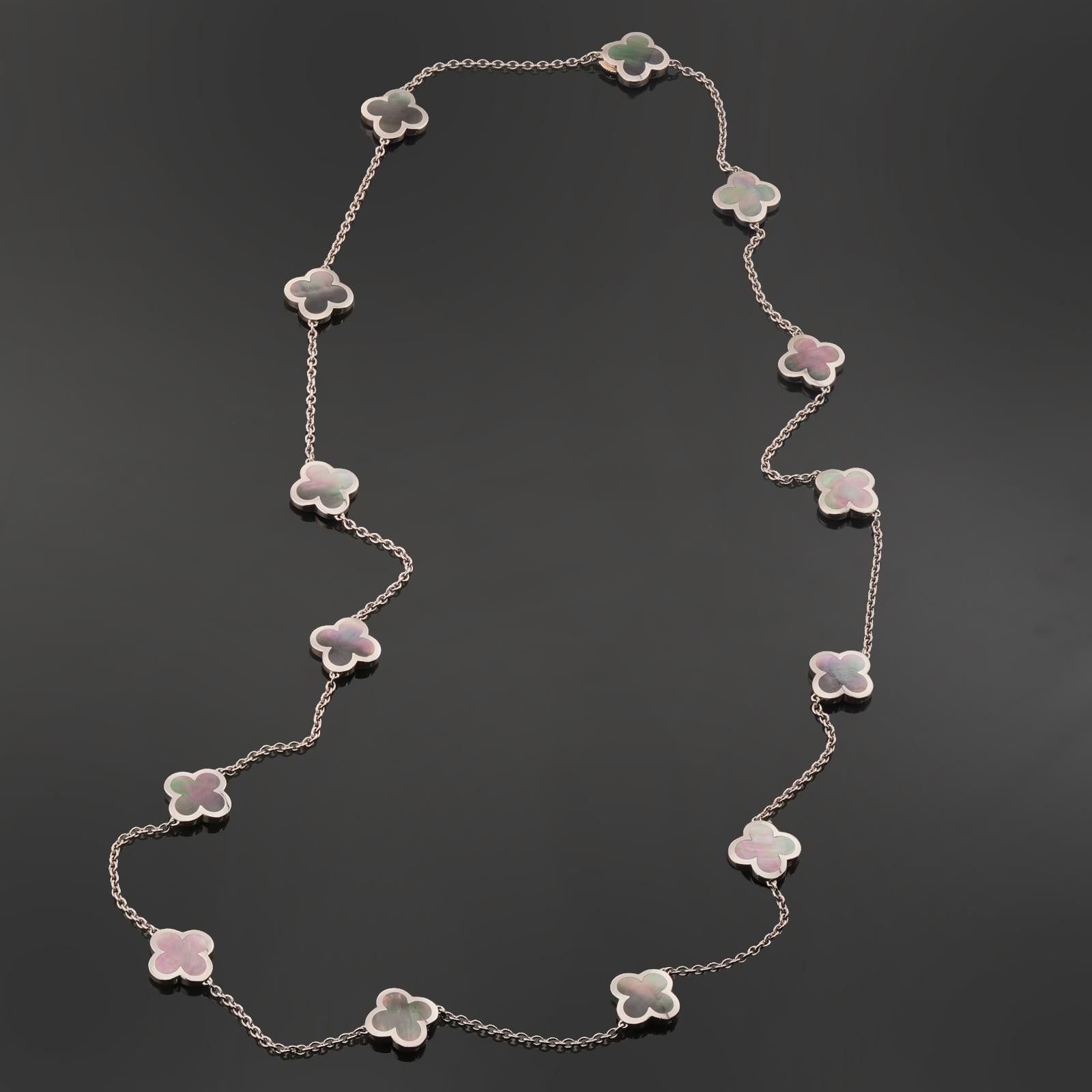 This classic Van Cleef & Arpels necklace from the Pure Alhambra collection is crafted in 18k white gold and features 14 lucky clover motifs inlaid with gray mother-of-pearl and completed with a concealed clasp. Made in France circa 2011.