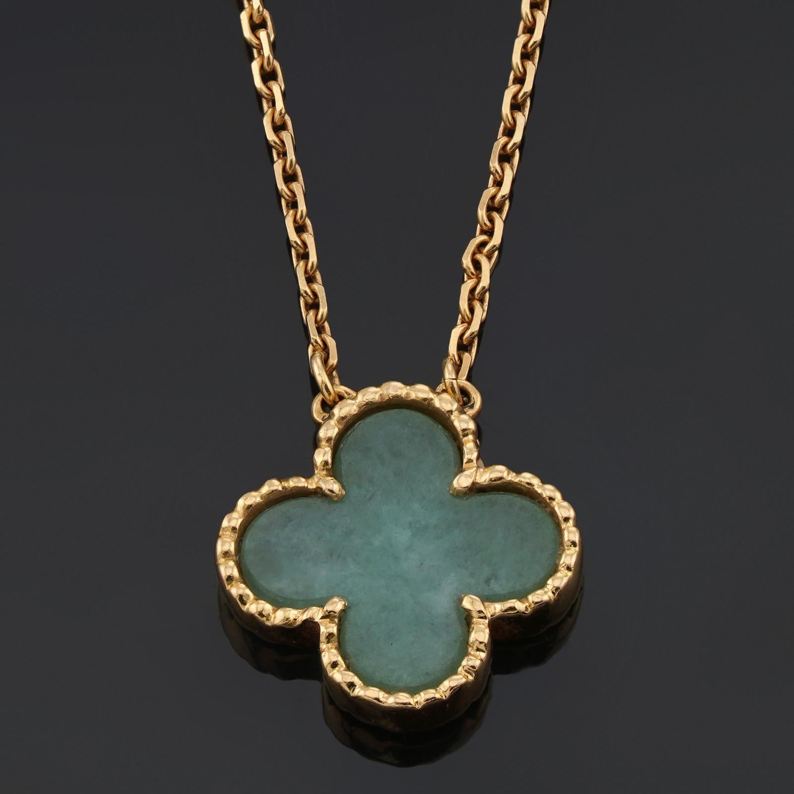 This rare necklace Van Cleef & Arpels from the iconic Vintage Alhambra collection features a green jade lucky clover pendant set in 18k yellow gold completed with an adjustable chain with a length of 15 to 16.75 inches. Made in France circa 1990s.
